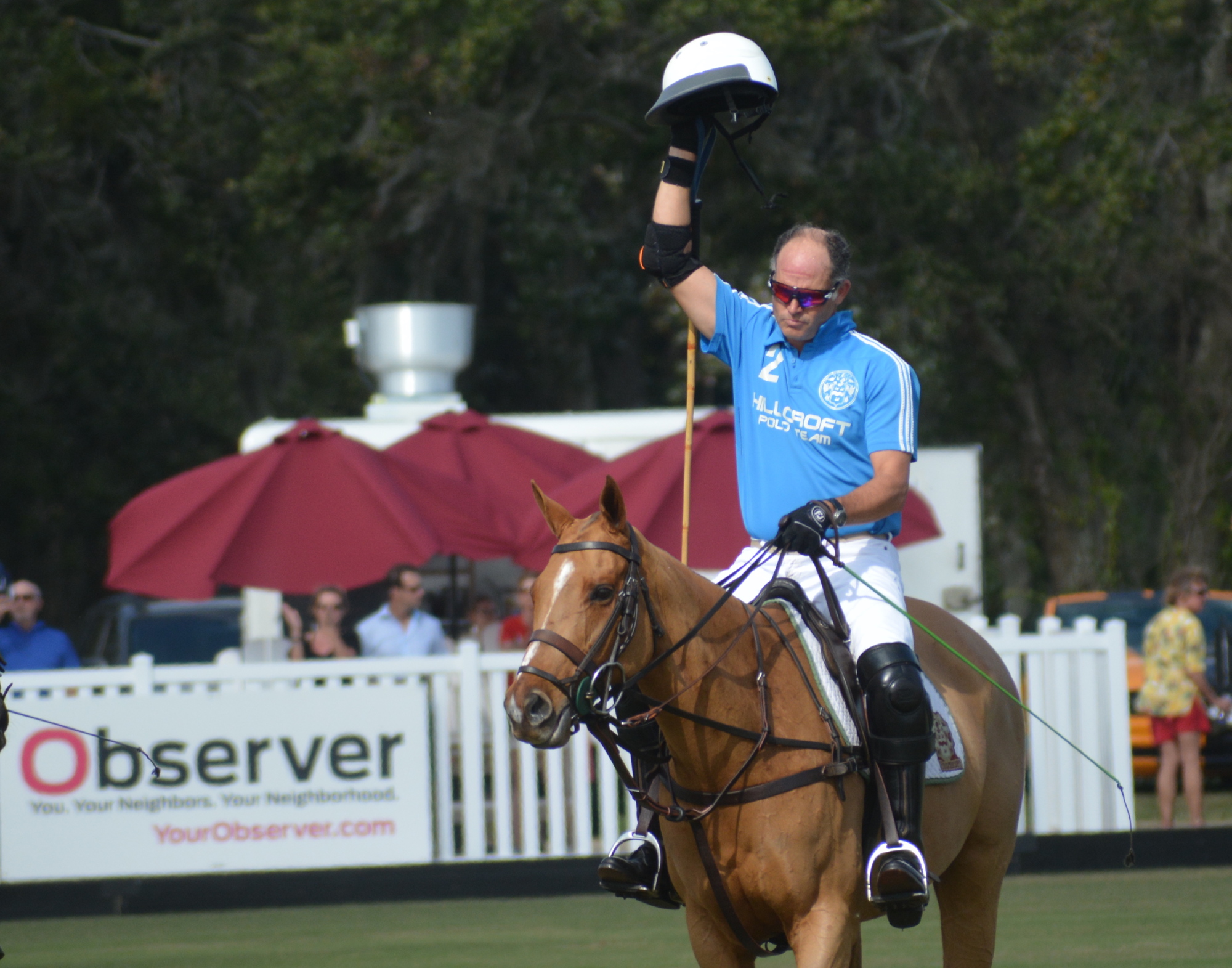 James Miller salutes the crowd on another packed Sunday at the Sarasota Polo Club.