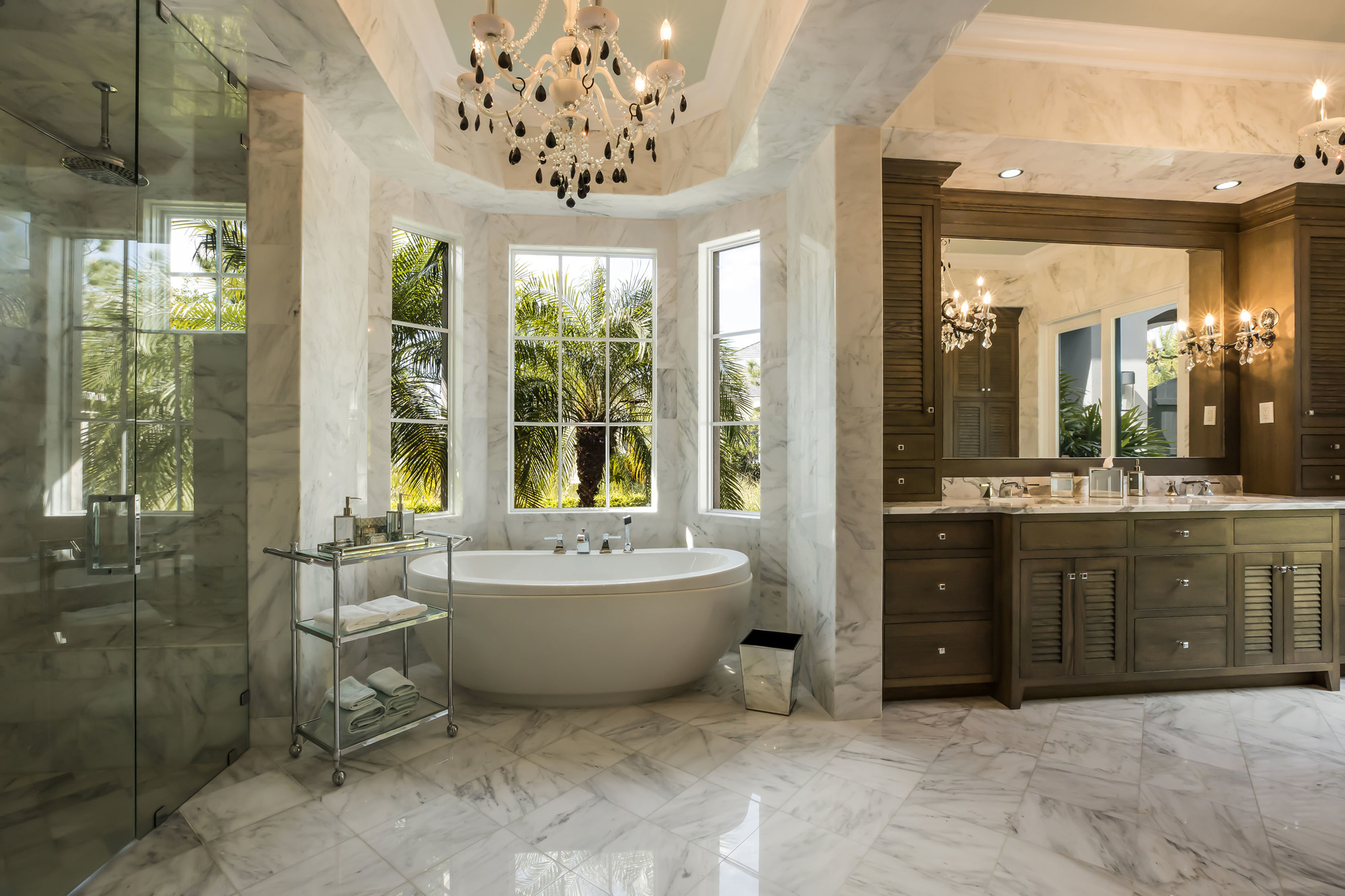 A glamorous marble-clad bathroom worthy of a luxury hotel adds a note of elegance to the master suite.