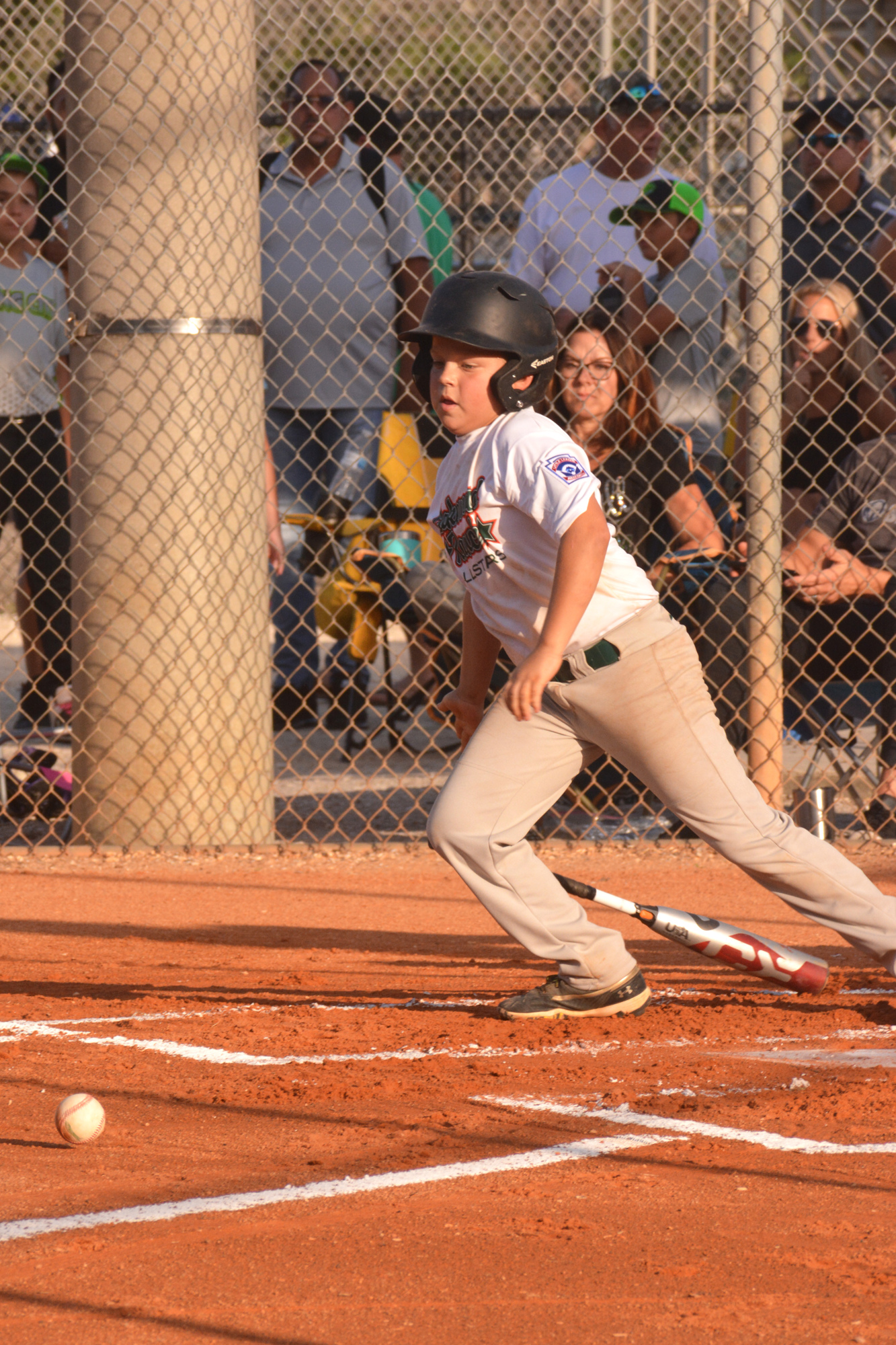 Lakewood Ranch's Cole Vogel hurries out of the batter's box after hitting a short grounder against Manatee.