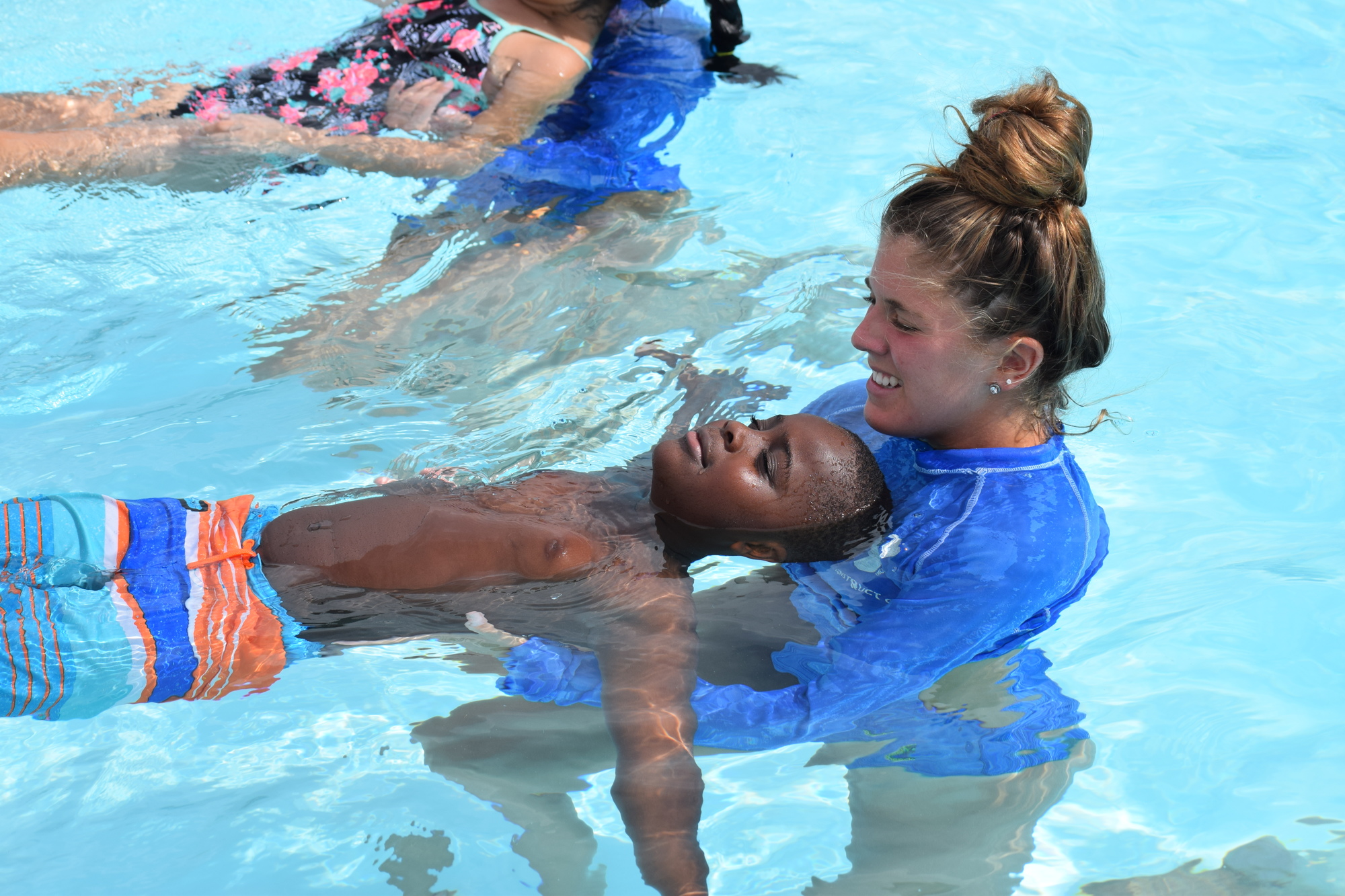 Janelle Greene teaches Sarasota's Jamarion Sorey to float.