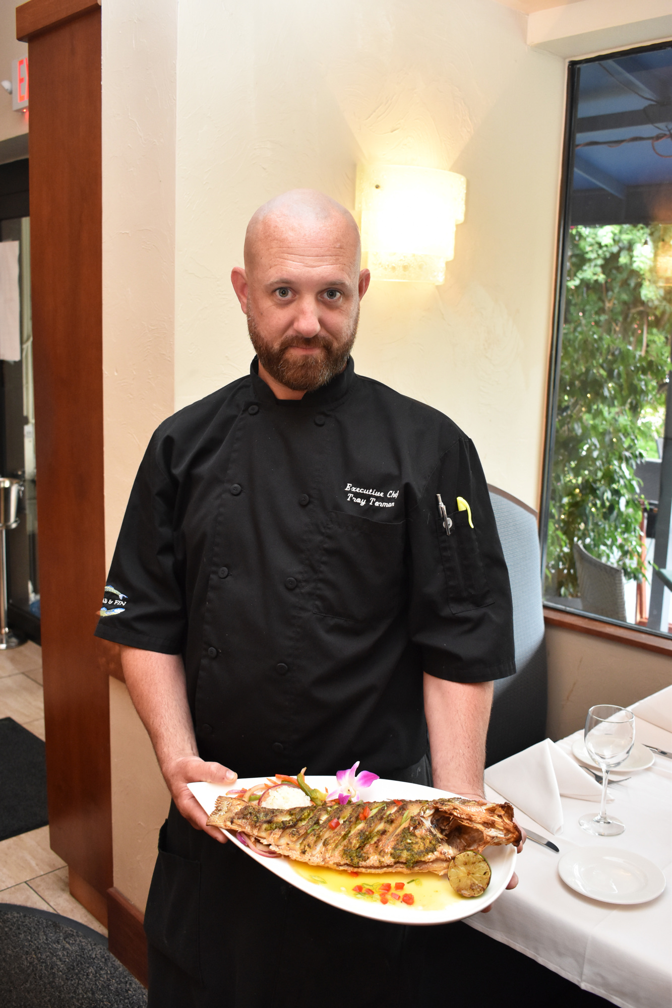 Chef Troy Torman of Crab & Fin offers six oyster varietals and seven to nine fish options daily. Photo by Niki Kottmann