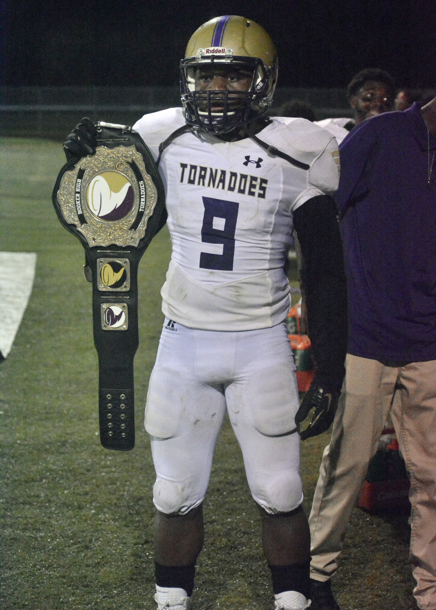 Booker senior Darrion Marshall shows off the Tornadoes' playmaker belt after returning a fumble for a touchdown