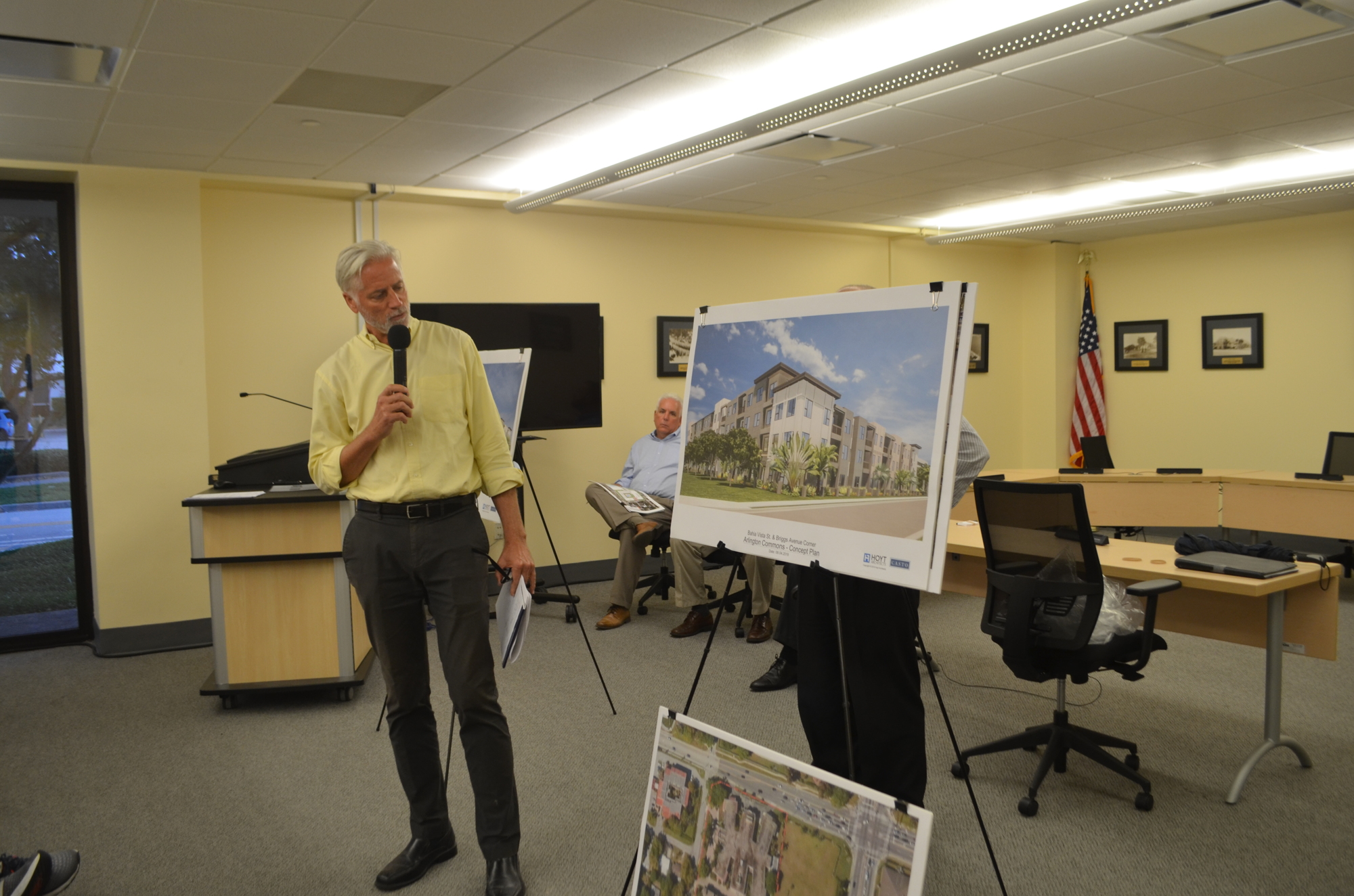 Chris Gallagher, a designer with Hoyt Architects, presented conceptual renderings for the Arlington Commons project at Monday's community workshop.