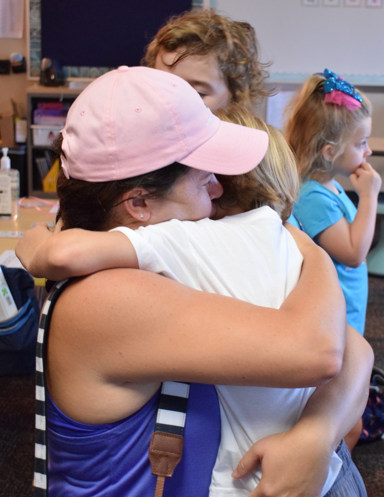 Greenbrook resident Melissa Murphy hugs her 5-year-old son Logan goodbye before leaving his kindergarten class to take her 7-year-old son Austin to his second-grade class.