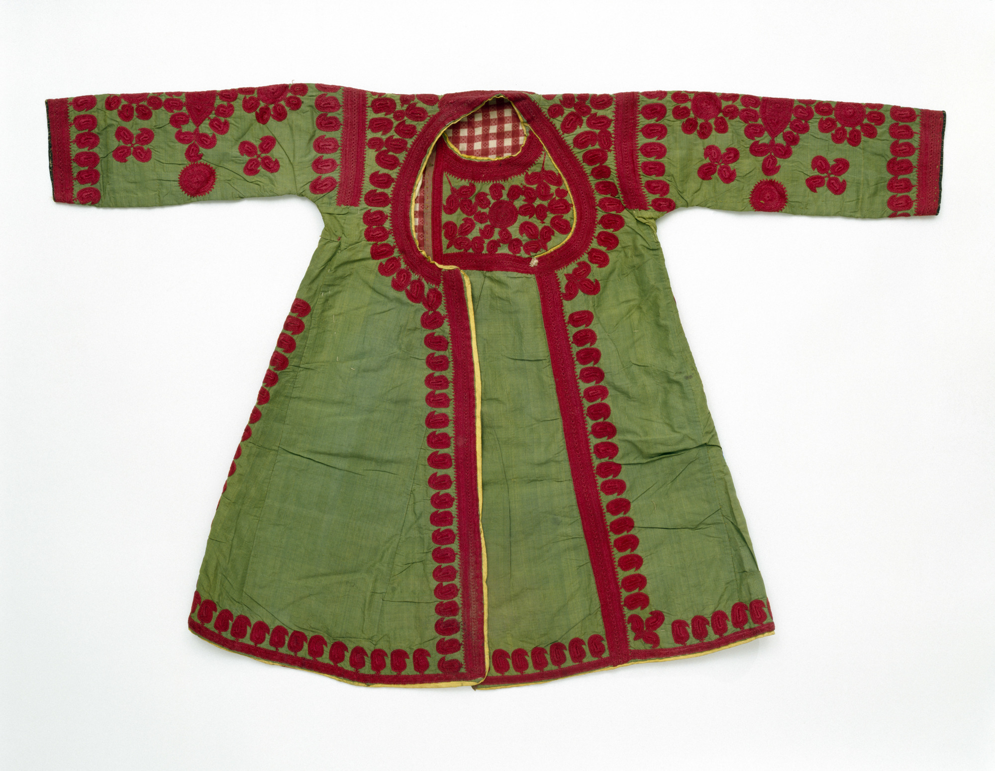Child’s dress (angarkha) circa 1900 made of silk embroidered with silk, lined with printed  cotton; 59 centimeters long; given by Lady Ratan Tata — Photos courtesy Victoria and Albert Museum, London
