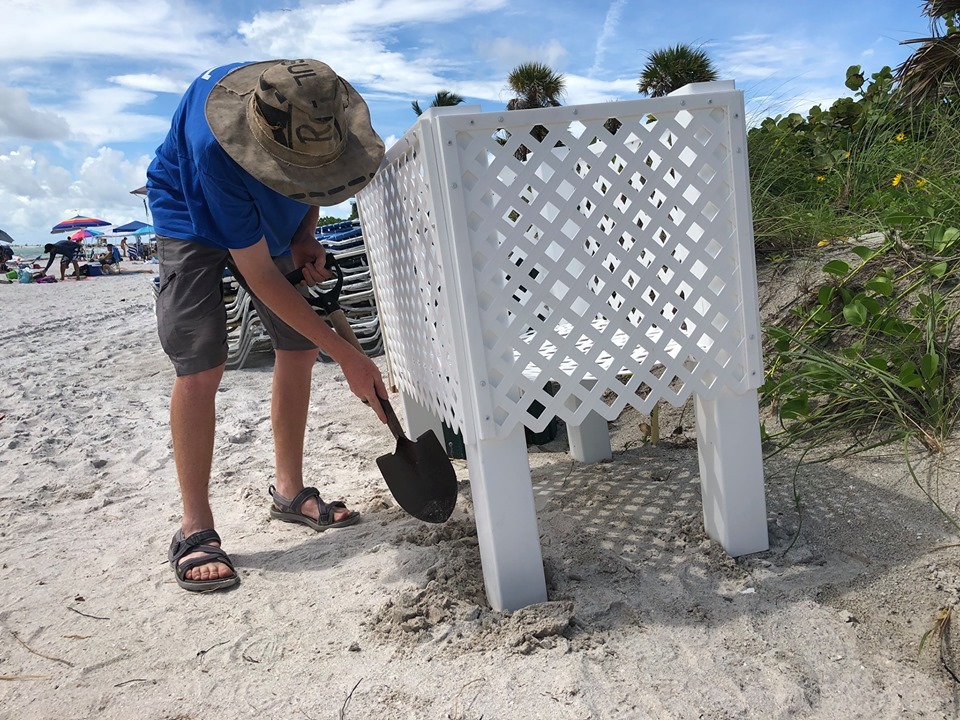 Caleb Jameson installs the Turtle Safe Toy Box on Lido Beach. Courtesy of the city of Sarasota