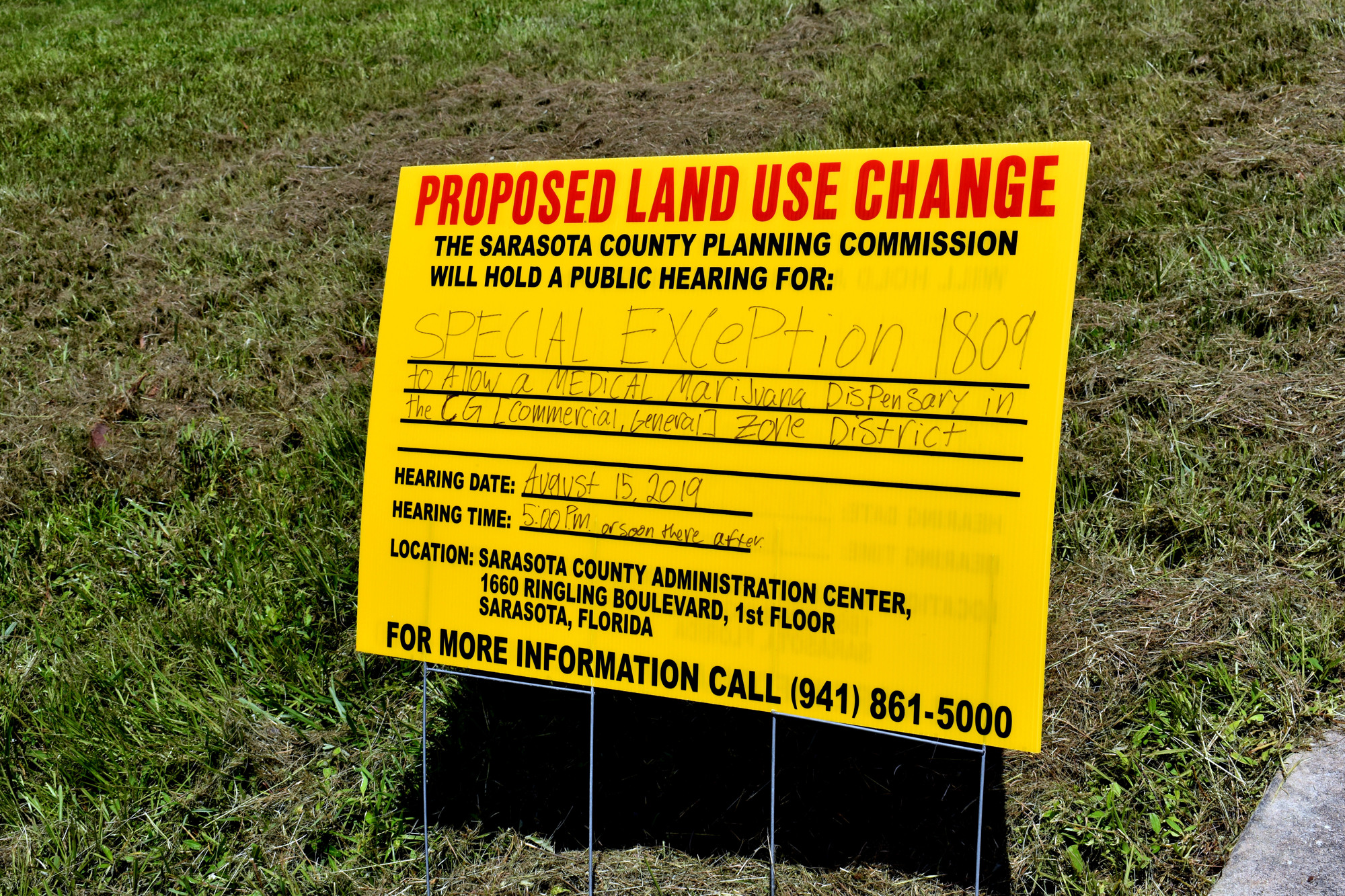 A sign on the proposed site at 2864 Clark Road announces the intent for the property.
