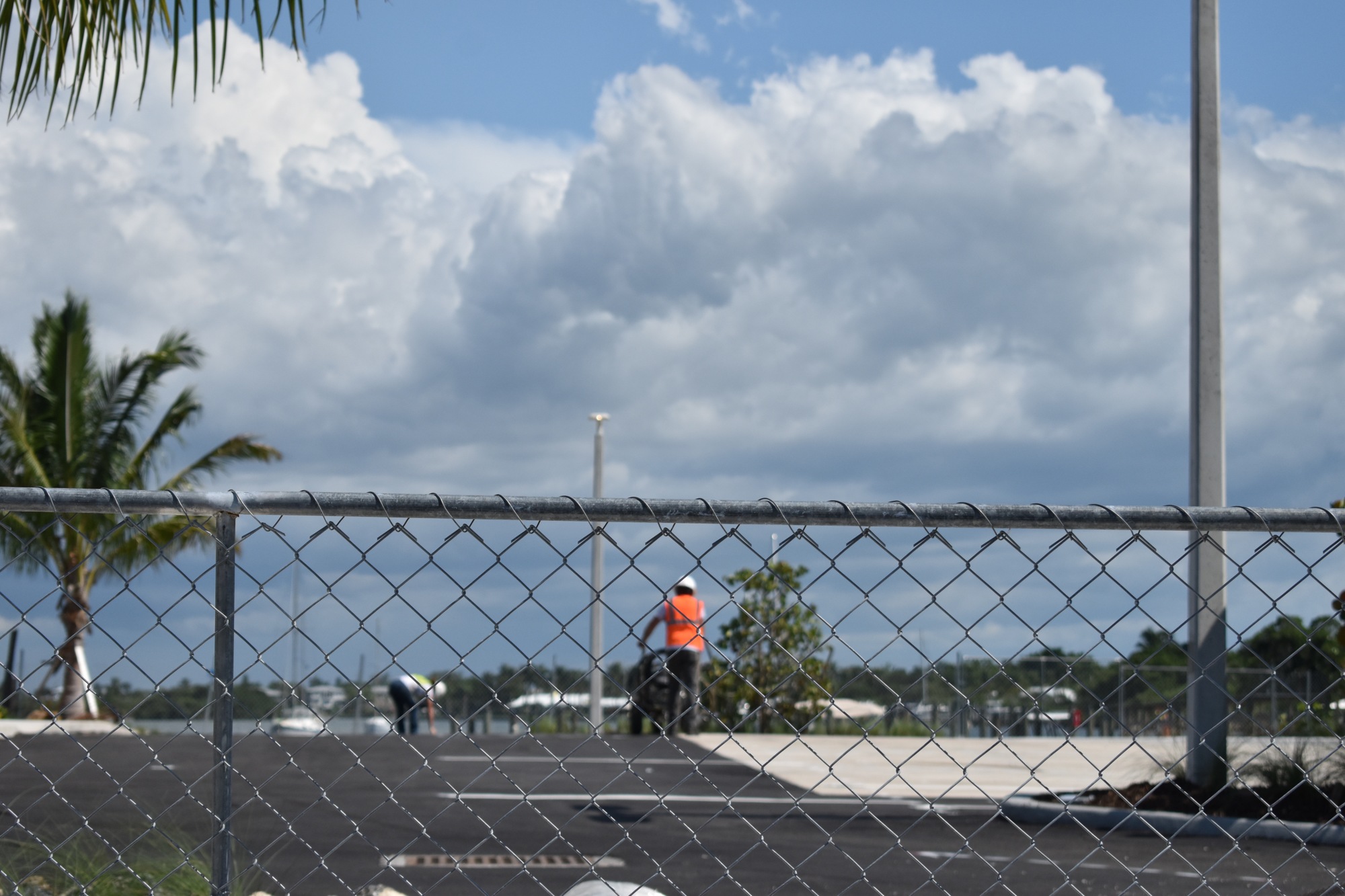 Workers paint parking lines on Aug. 23, 2018.