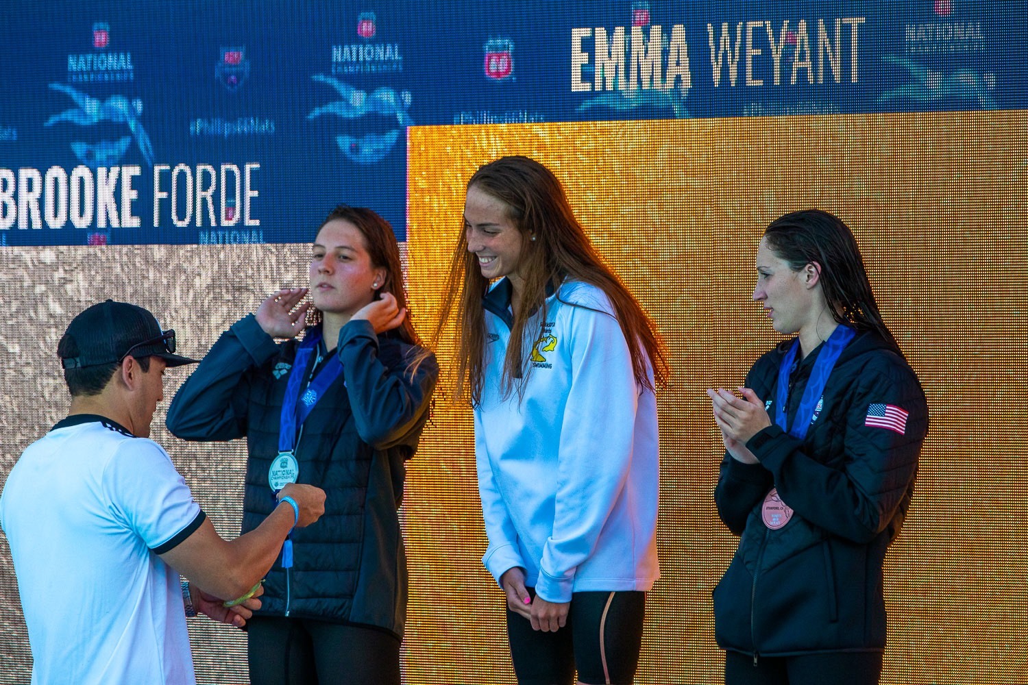 Emma Weyant receives her national gold medal, flaked by second-place Brooke Forde and third-place Ally McHugh. Photo courtesy Emma Weyant.