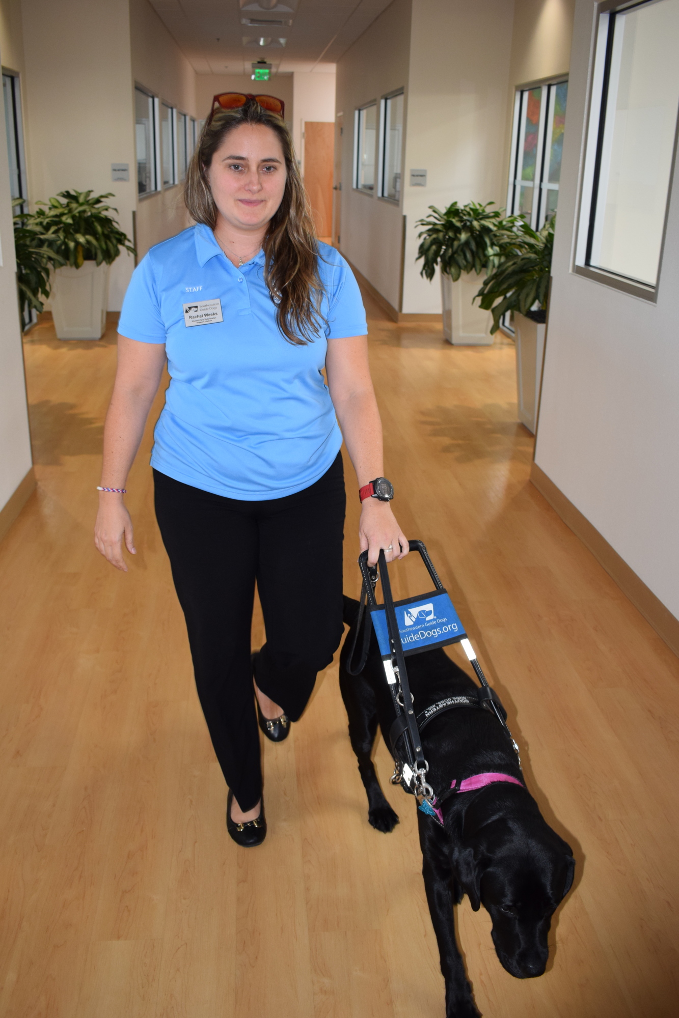 Rachel Weeks and Plum head to another office at Southeastern Guide Dogs in Palmetto.