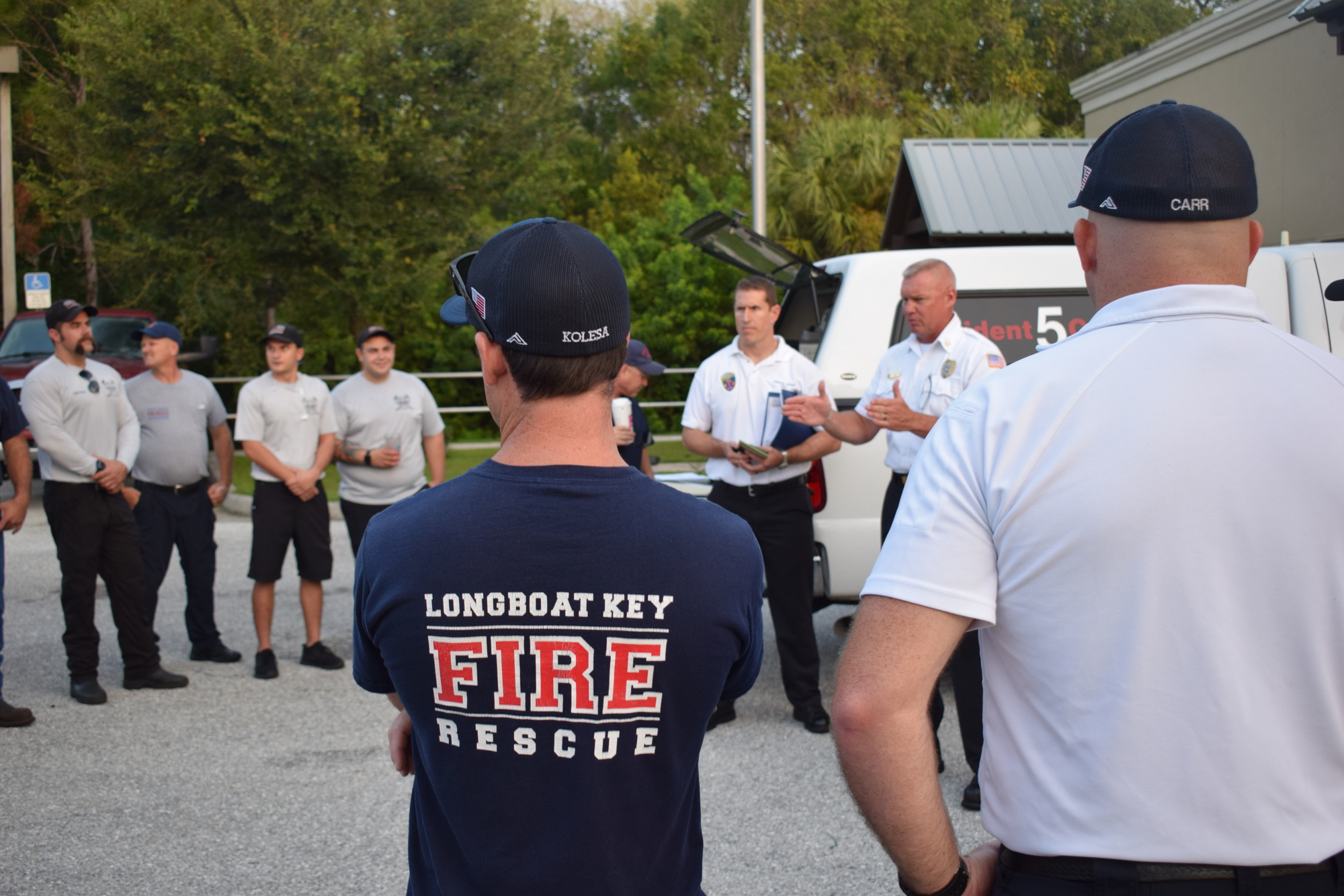 Lt. Brian Carr and firefighter/paramedic Brian Kolesa listen to a briefing Monday morning before heading out to the Orange County Convention Center.