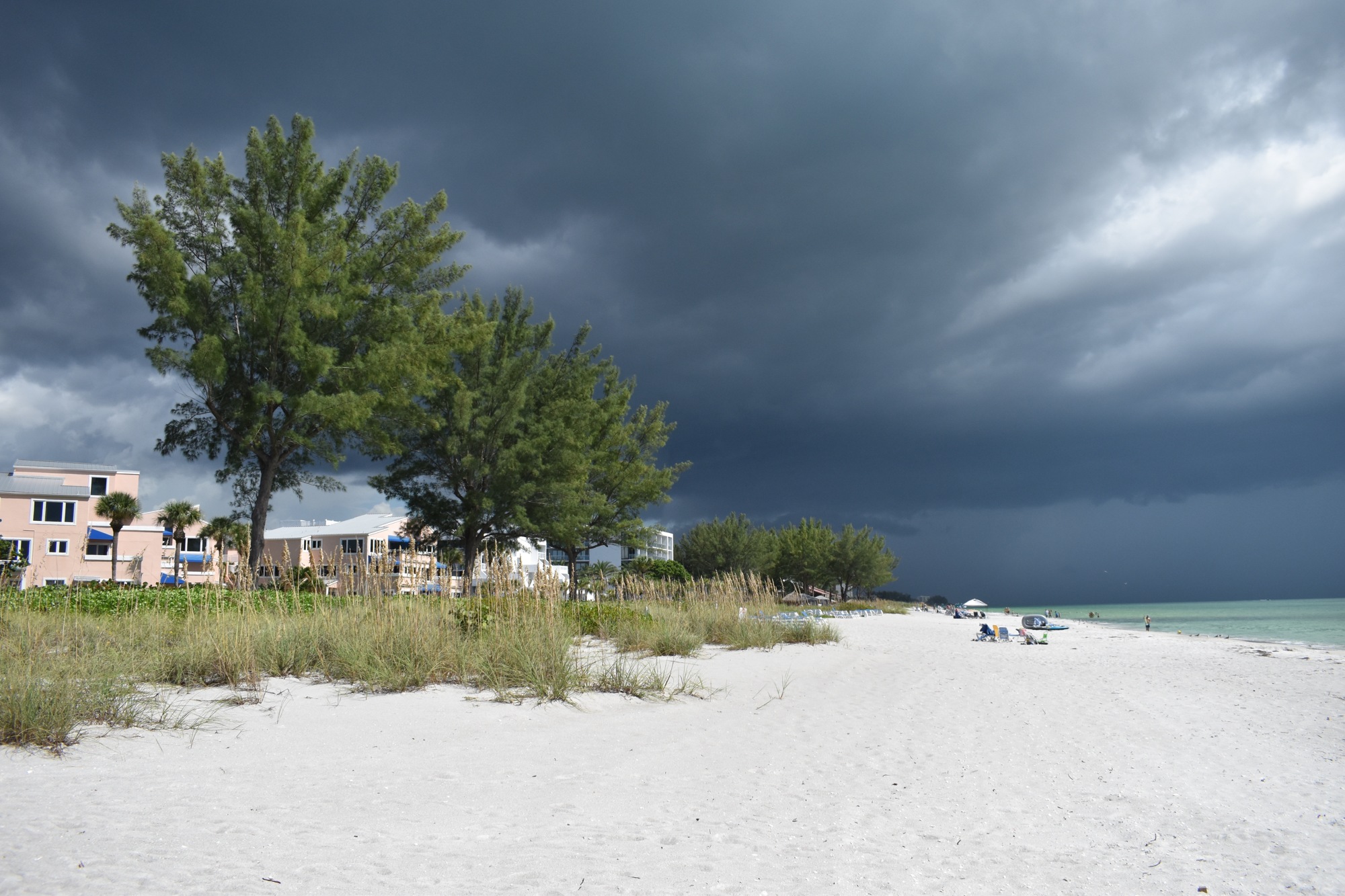 People remained on the beach despite the threat of an afternoon storm on Sept. 1. Photo by Sten Spinella. 