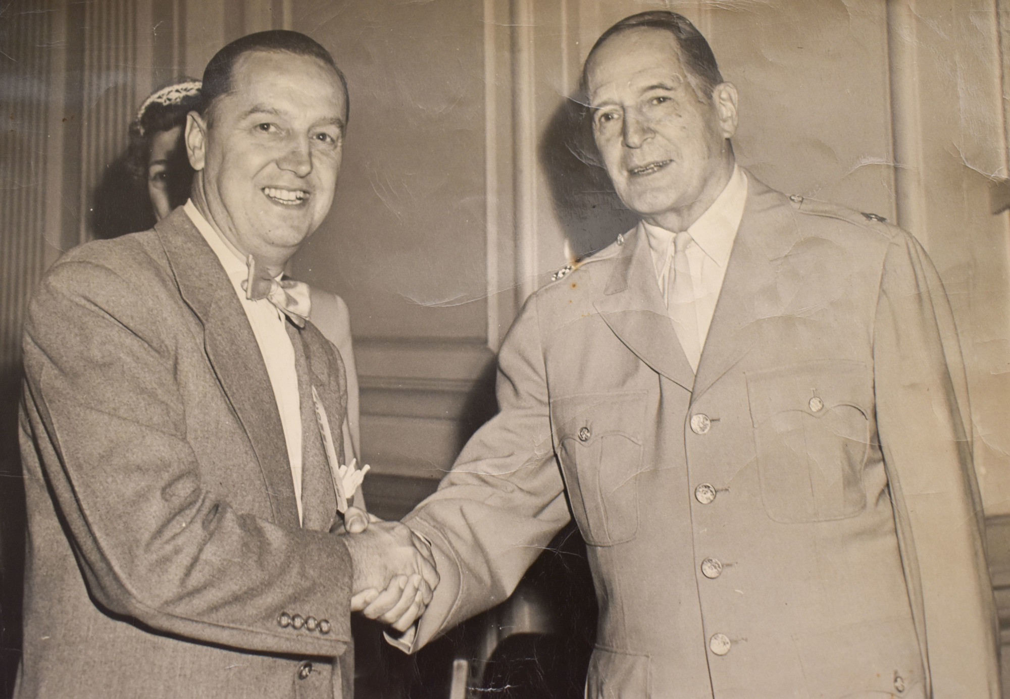 Ray Turk Sr. shakes the hand of General Douglas MacArthur.