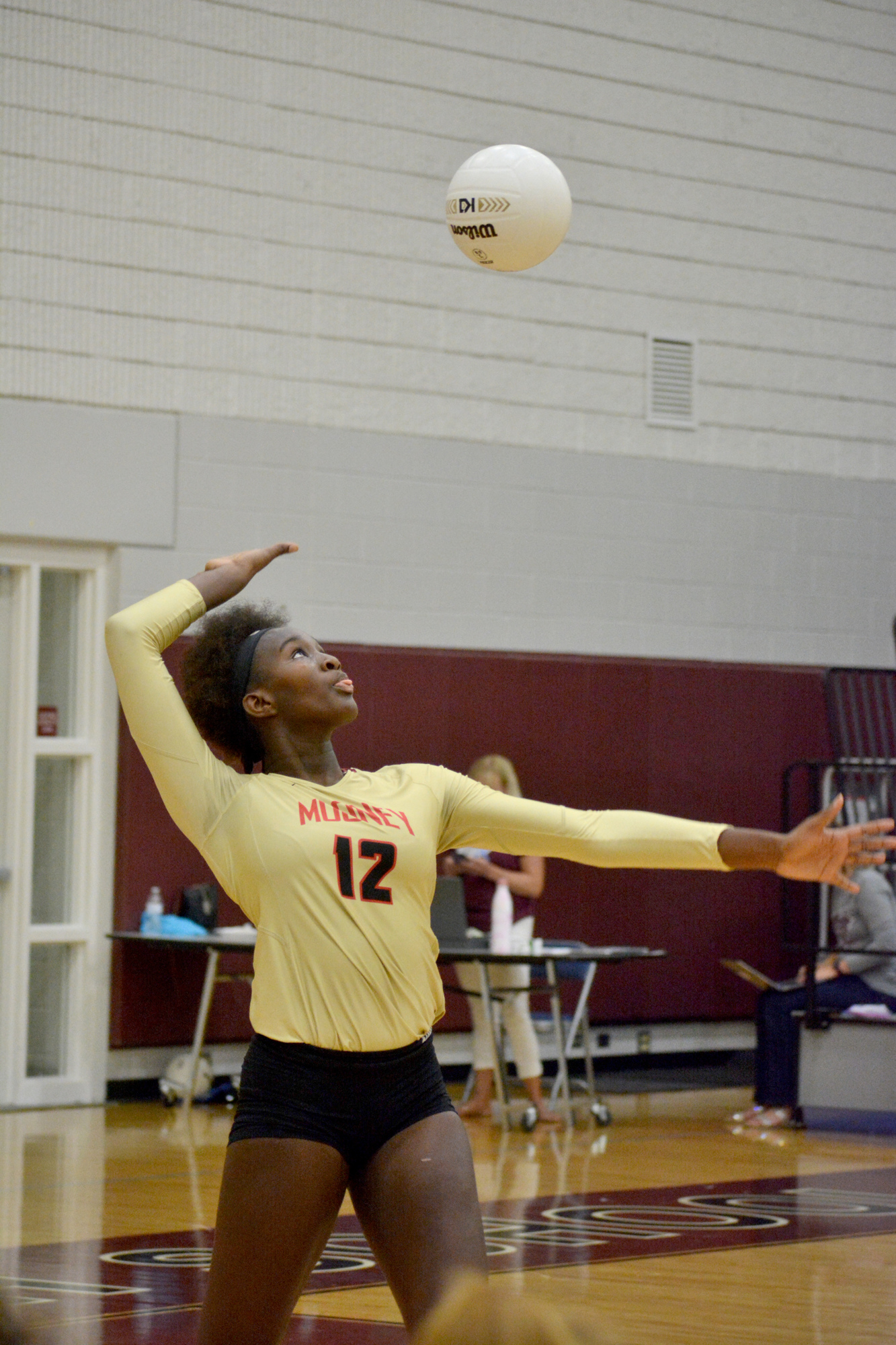 Volleyball freshman Jordyn Byrd (12) is a force in the middle for Cardinal Mooney.