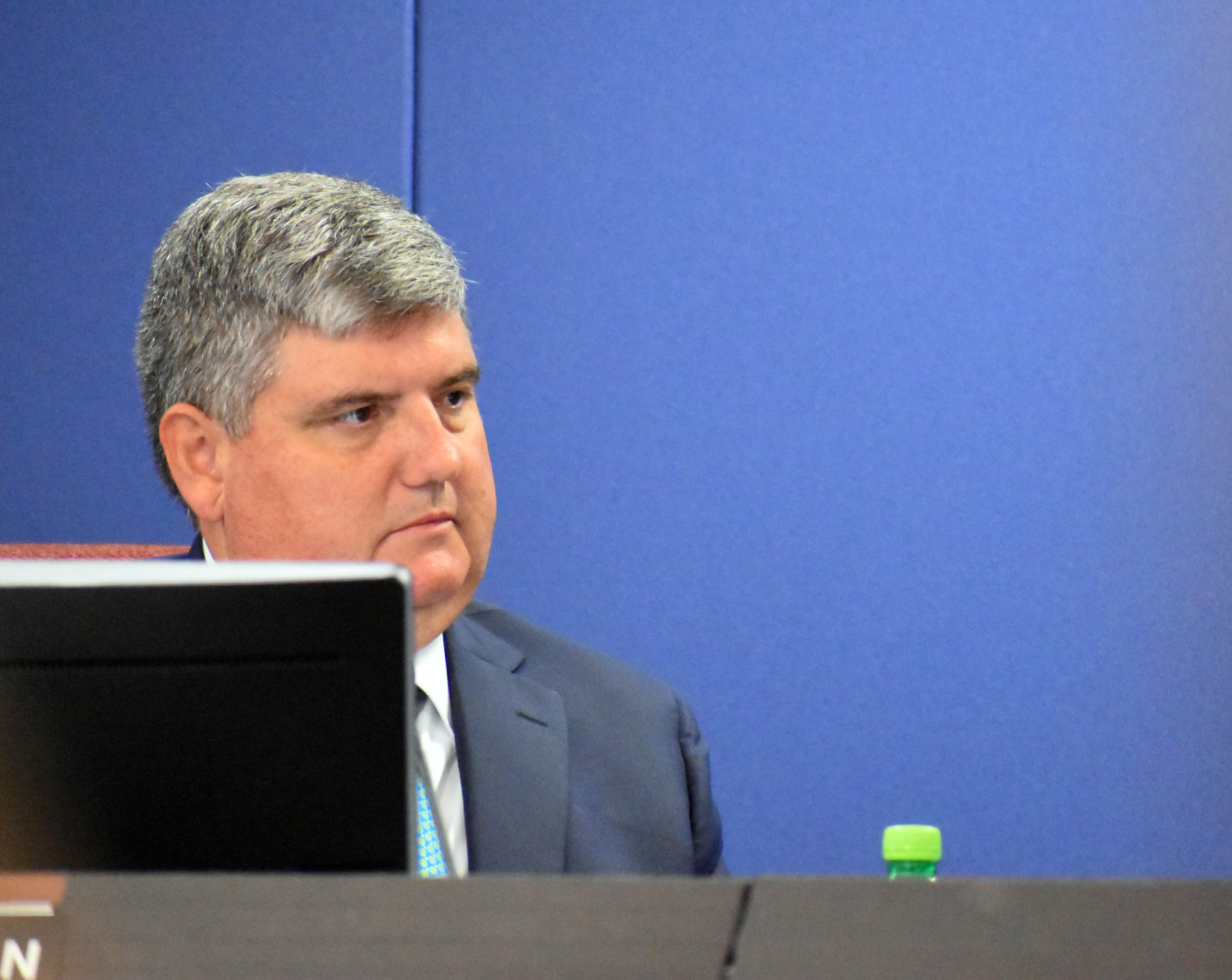 Superintendent Todd Bowden listens to board members debate.