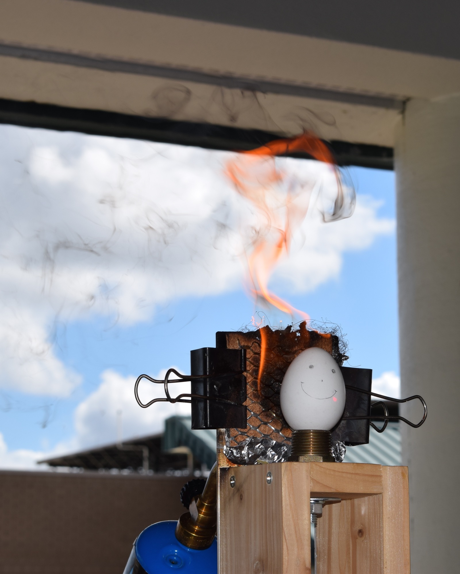 A group's shield catches fire during its five minutes under intense heat. The egg was only slightly cooked at the end of testing.