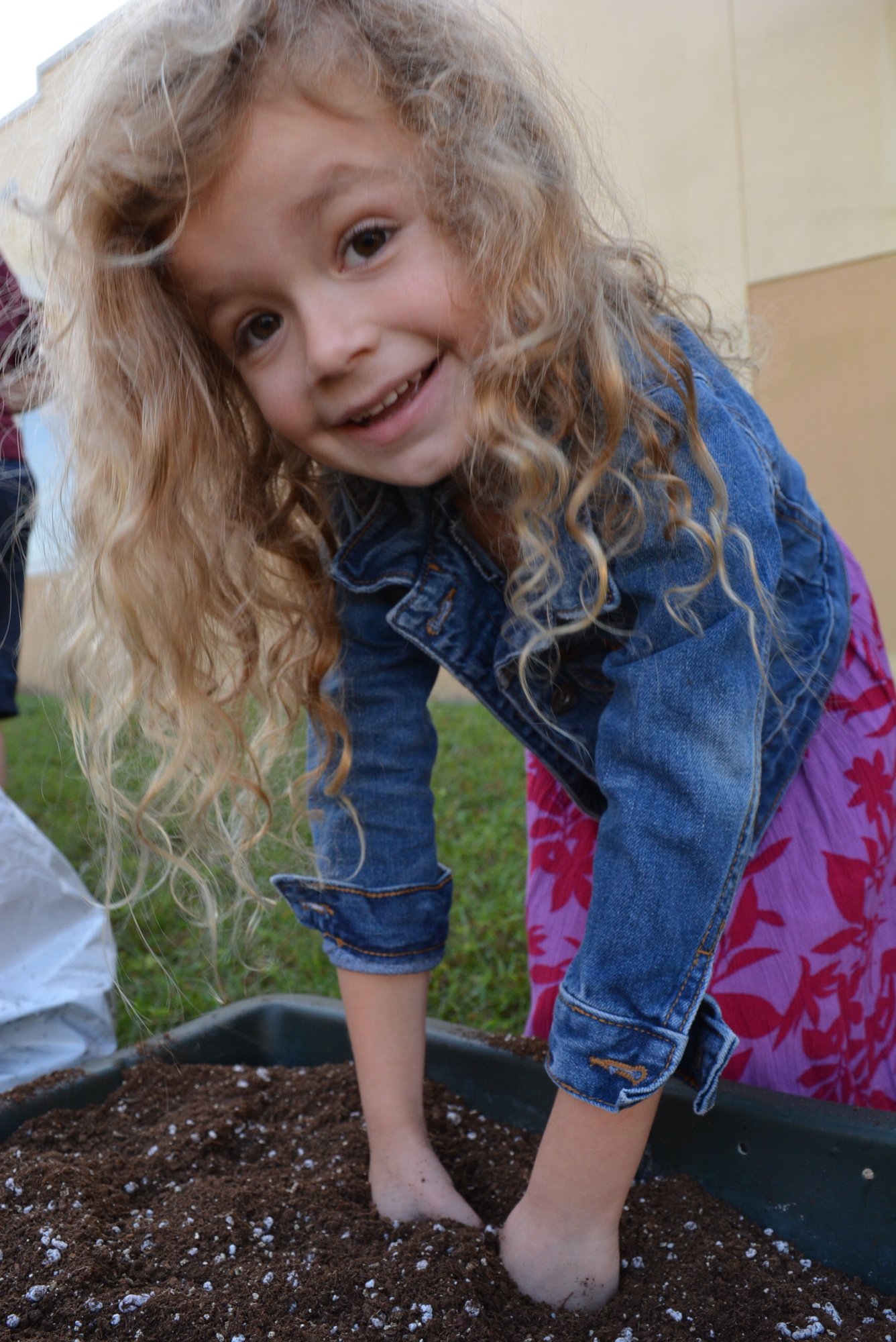Five-year-old Emory Sanders says the dirt feels like pillows.