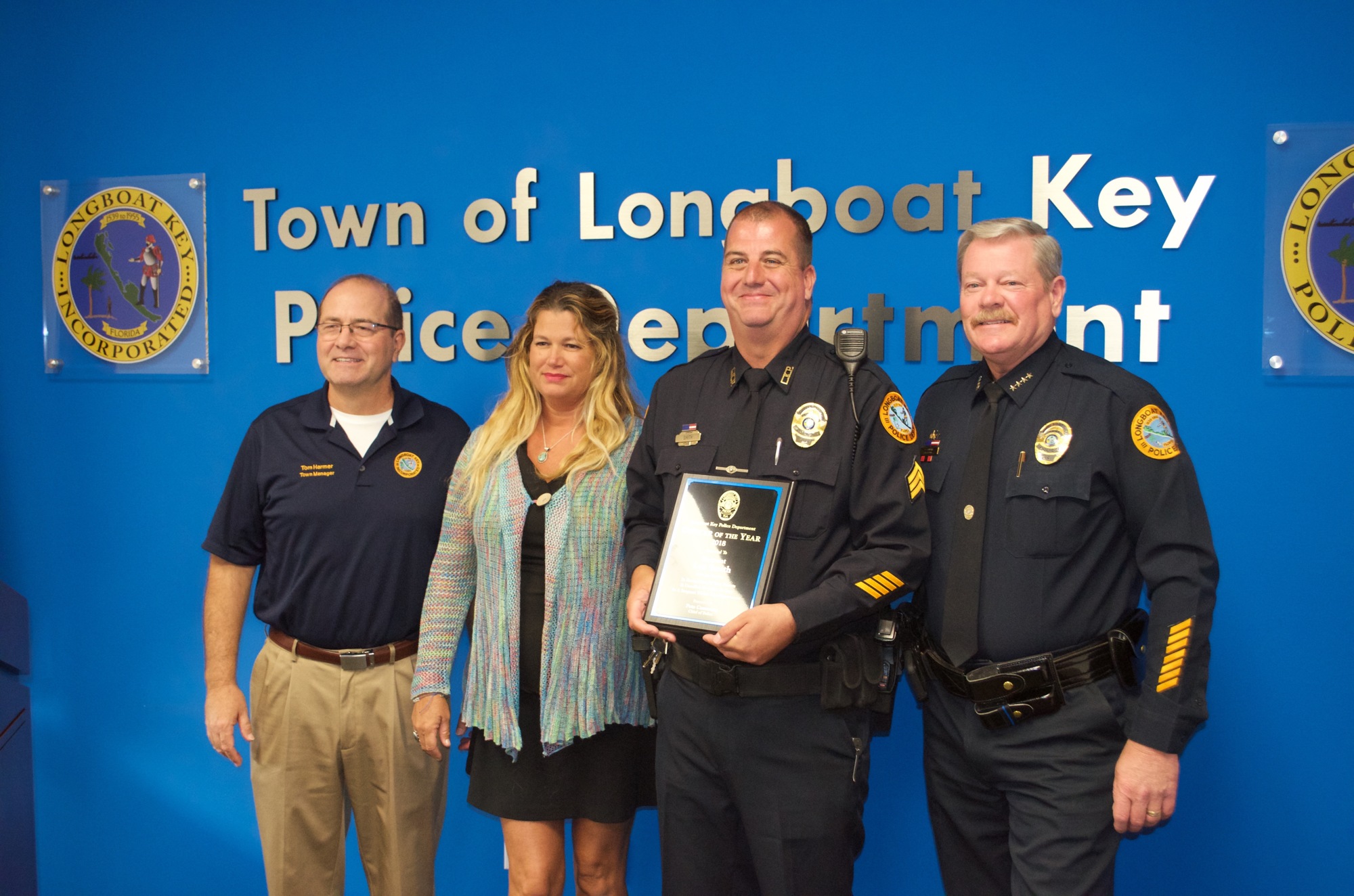 Officer of the year Sgt. Lee Smith is honored at police headquarters. 