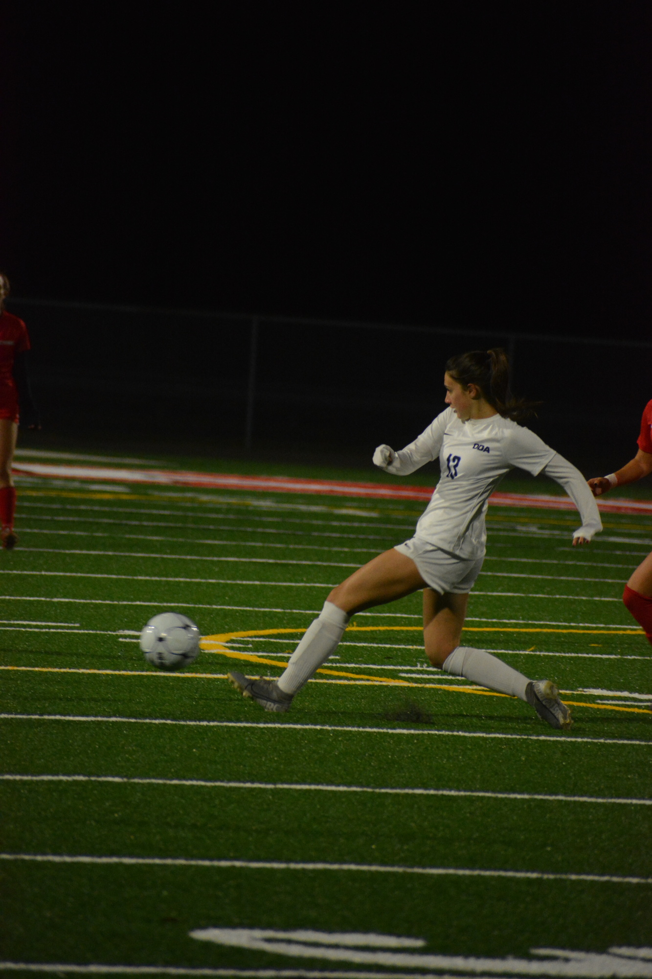 Natalie Gorji fires a ball to a teammate against Cardinal Mooney High.