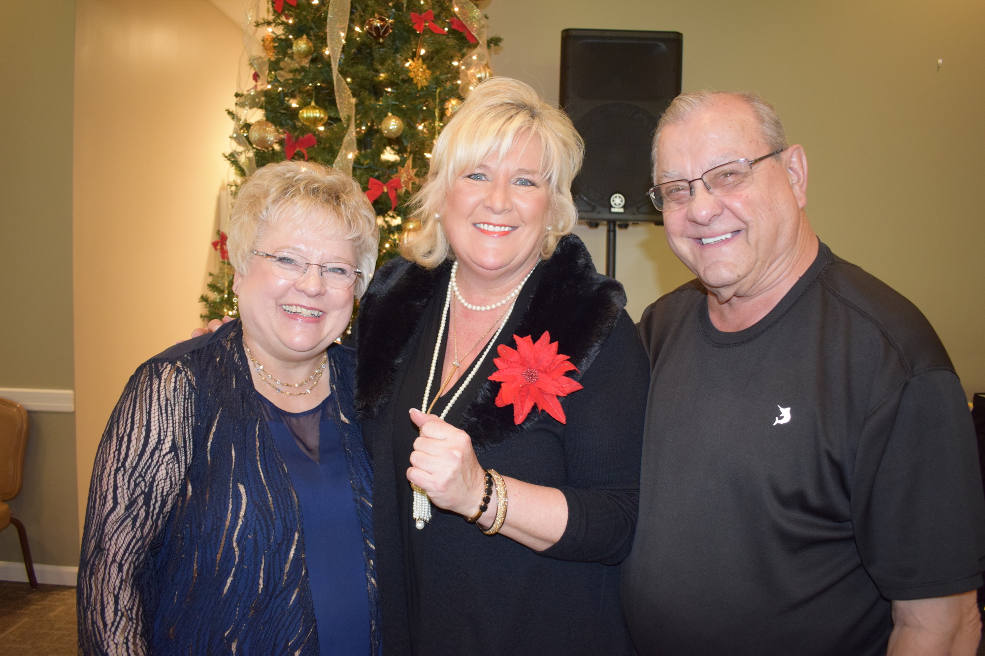 Phyllis and Chuck Stolteben of Lynn's Spins stand with Meals on Wheels PLUS President and CEO Maribeth Phillips (center). The Stoltebens donated their musical performance to the event.