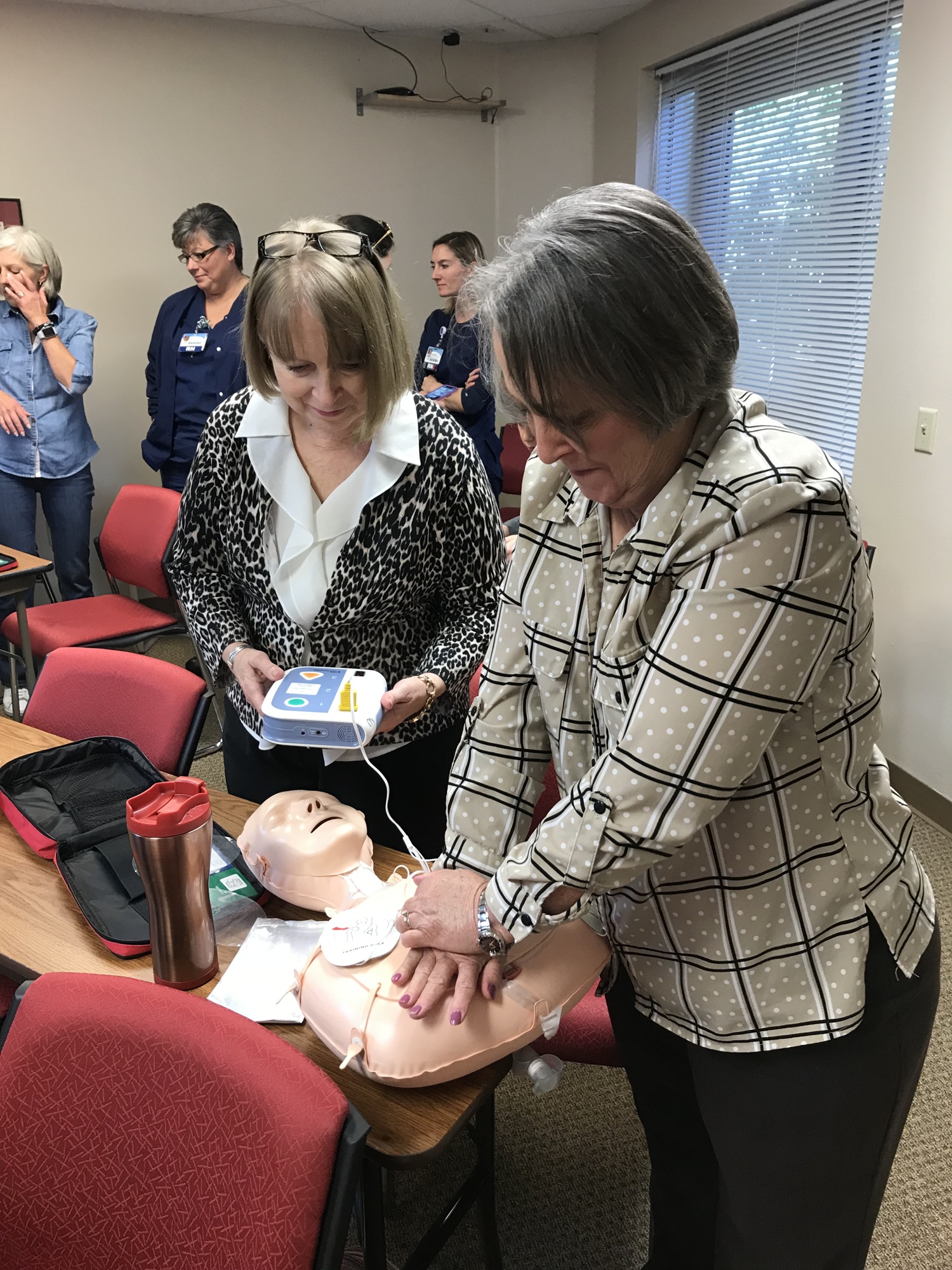 Two women practice CPR at a training session held by the Longboat Key Fire Rescue Department. (Courtesy of the Longboat Key Fire Rescue Department)