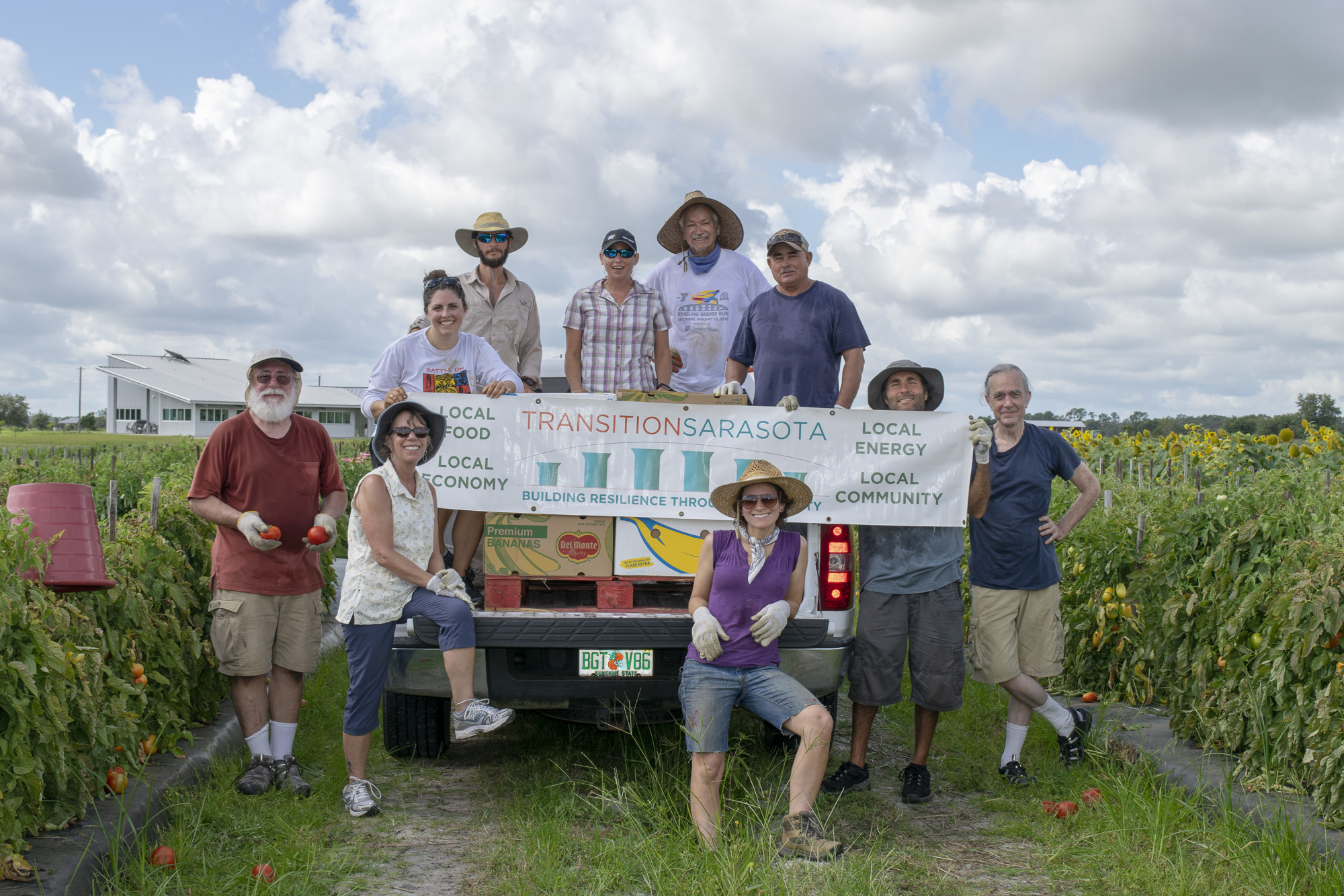 Transition Sarasota volunteers and a few members of the Enza Zaden Research Facility staff take a break from a hot morning of gleaning. Transition Sarasota has donated more than 298,000 pounds of produce to local food banks since