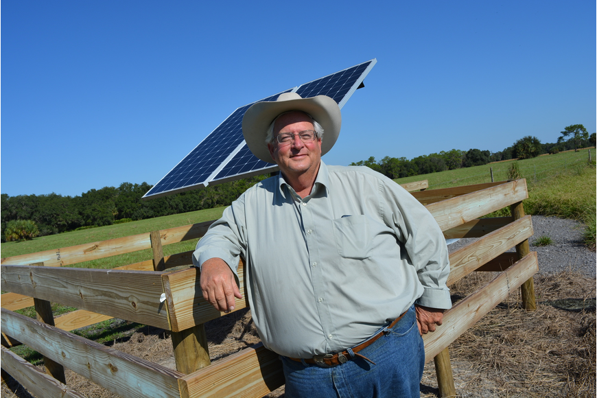 Jim Strickland shows off one of two solar-powered wells he uses to provide clean drinking water to his cattle.