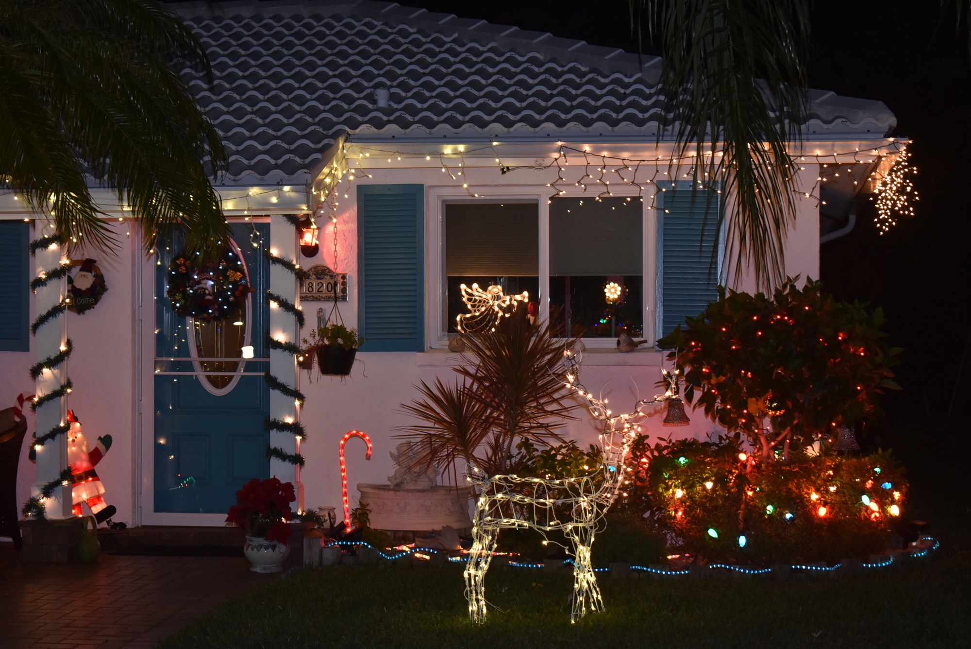 Along the main road in Spanish Main Yacht Club, this house twinkles merry and bright.