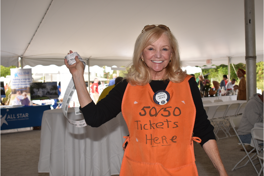 Phyllis Black sells raffle tickets at the 2019 Lawn Party.
