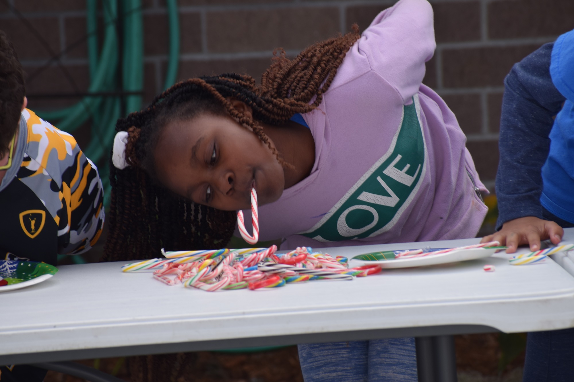 Kyla Smith-Bey, a fifth grader at Tara Elementary School, attempts to pick up as many candy canes as she can so she can win points for her house, Reveur.