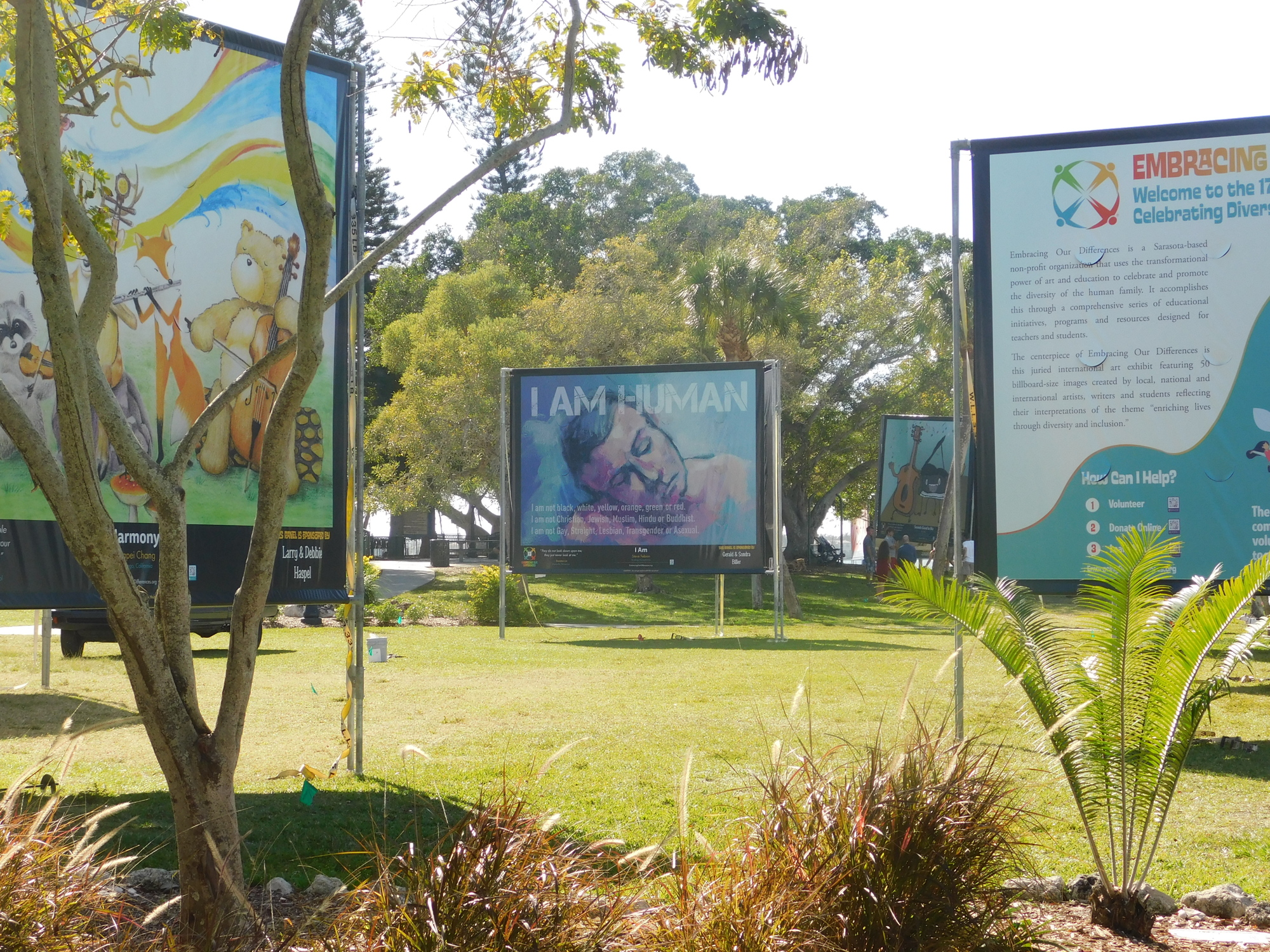 While the 12.5-by-16-foot images don't blend into the Bayfront Park landscape, they also fit in during their stay.