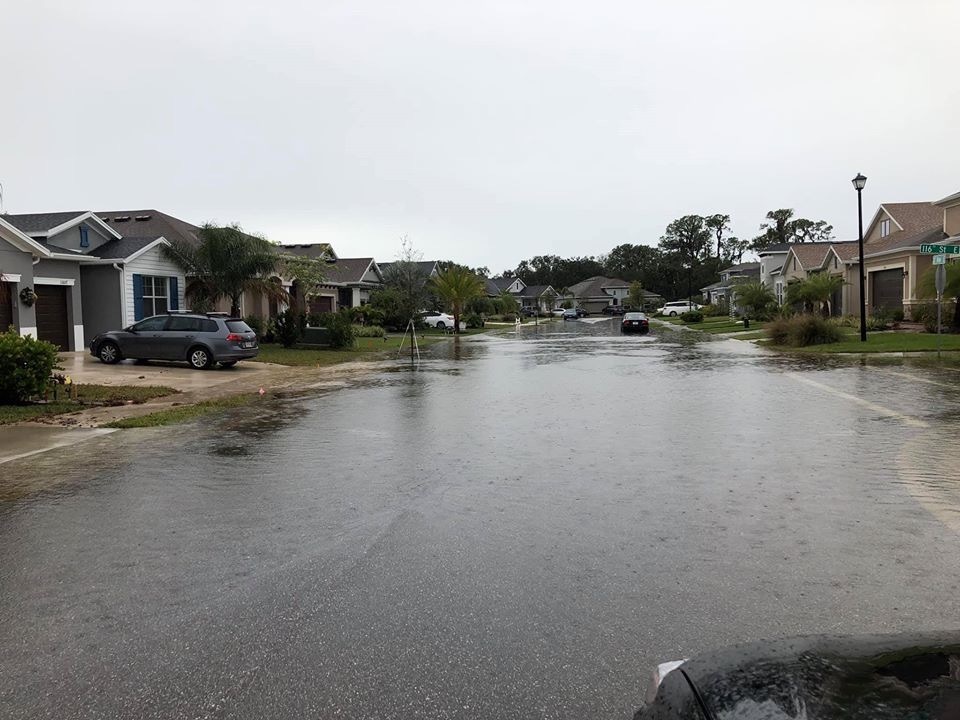 This image shows flooding in streets in the Osprey Landing community during a December 2018 storm. Manatee County stormwater staff said the developer has had to correct some deficiencies. Courtesy photo.