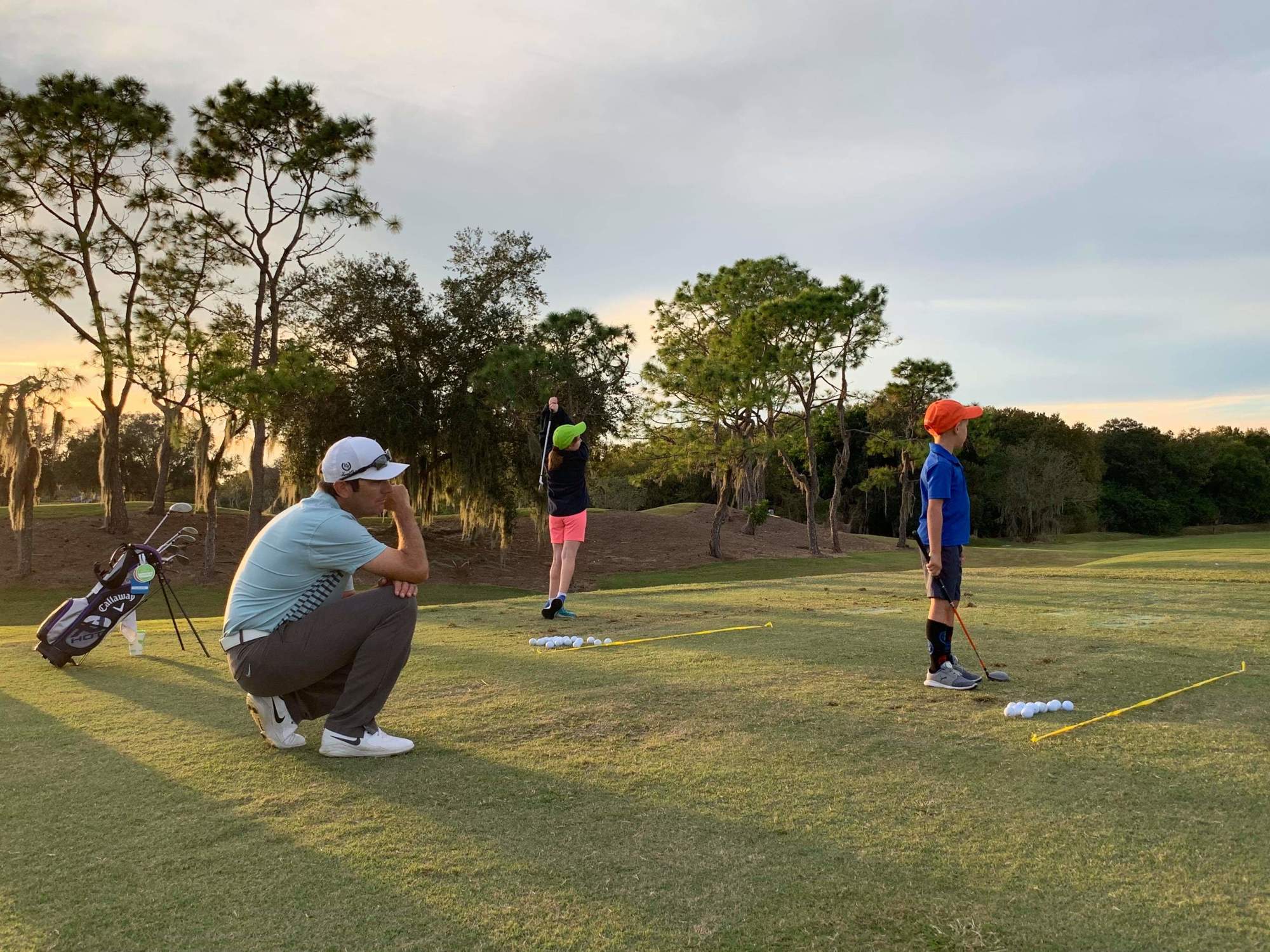Jon Bullas works with two young golfers at Laurel Oak Country Club. Photo courtesy Jon Bullas.