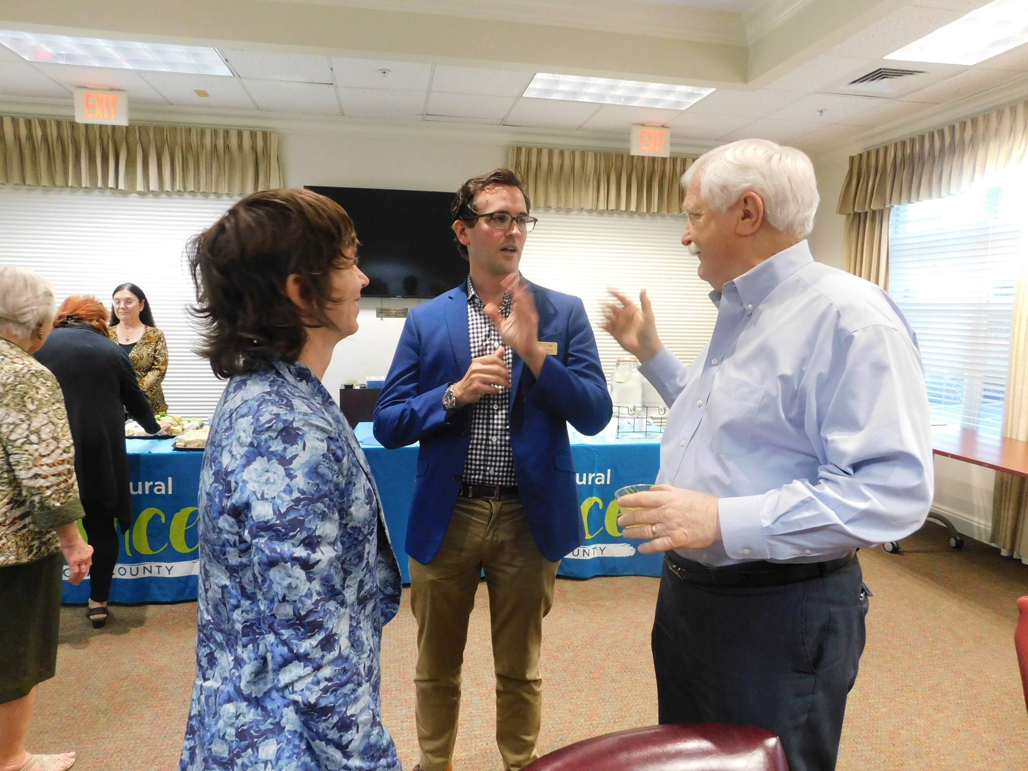 Andy Sandberg chats with Arts & Cultural Alliance of Sarasota Jim Shirley and flautist Claire Chase prior to a public introduction event  at the alliance's offices.