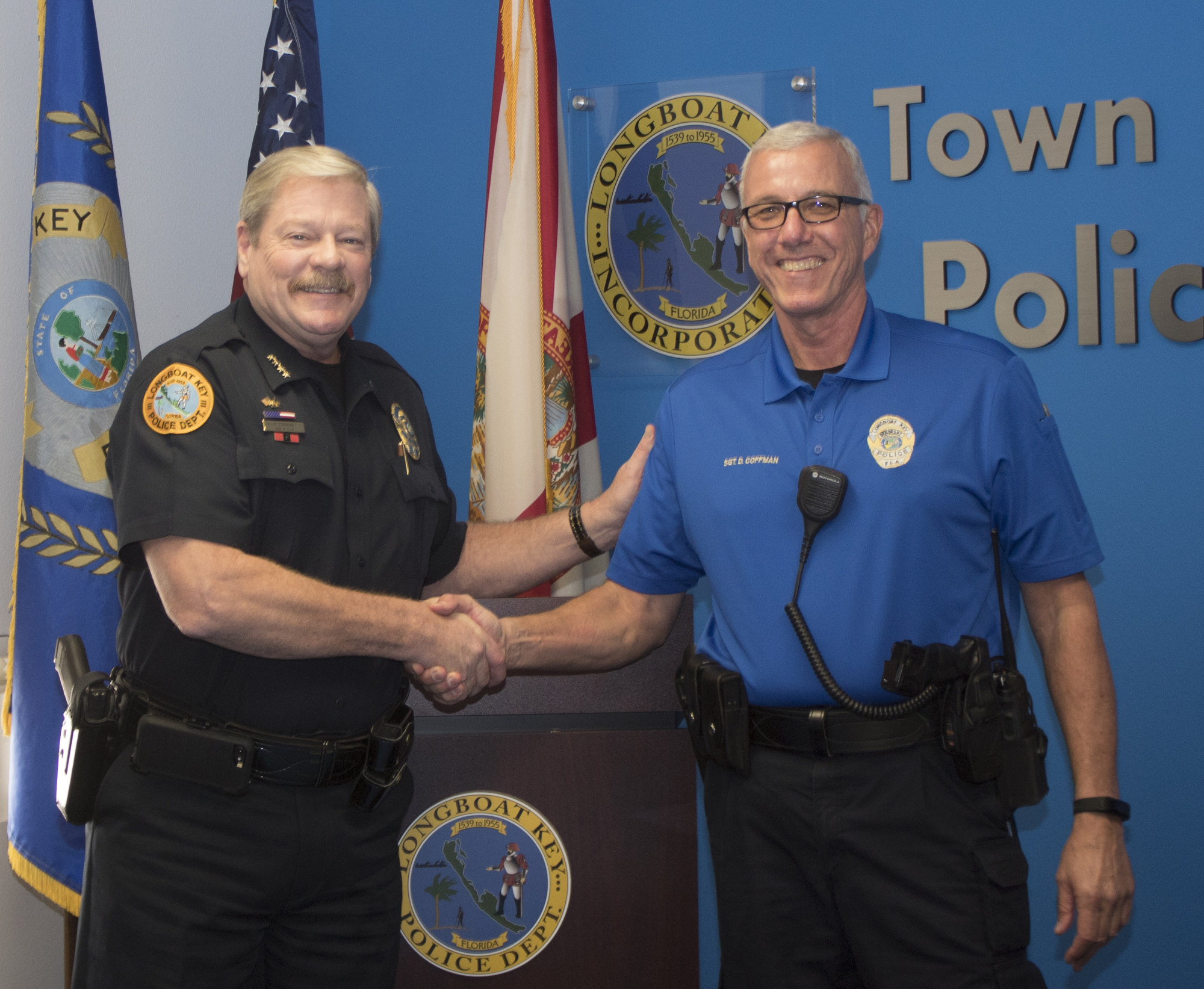 Police Chief Pete Cumming congratulates Sgt. Doug Coffman on his retirement from the Longboat Key Police Department and his 30 years in law enforcement.