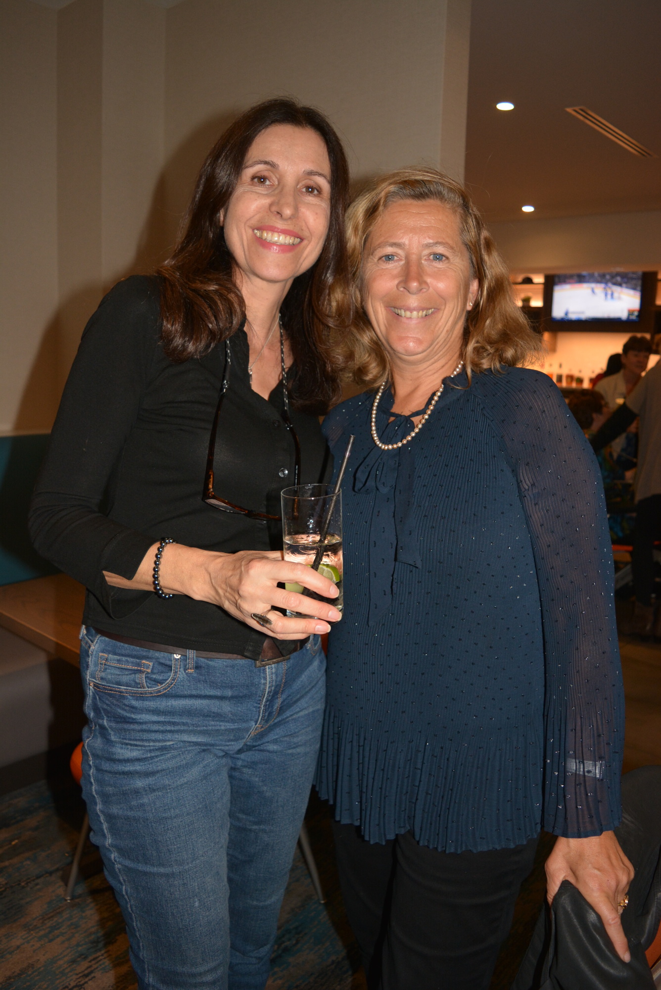 Event organizer and Riverwalk resident Régine Tatem met a fellow France native, Marie-Laure Ricaud, of Sarasota, who came to make friends and practice her English.