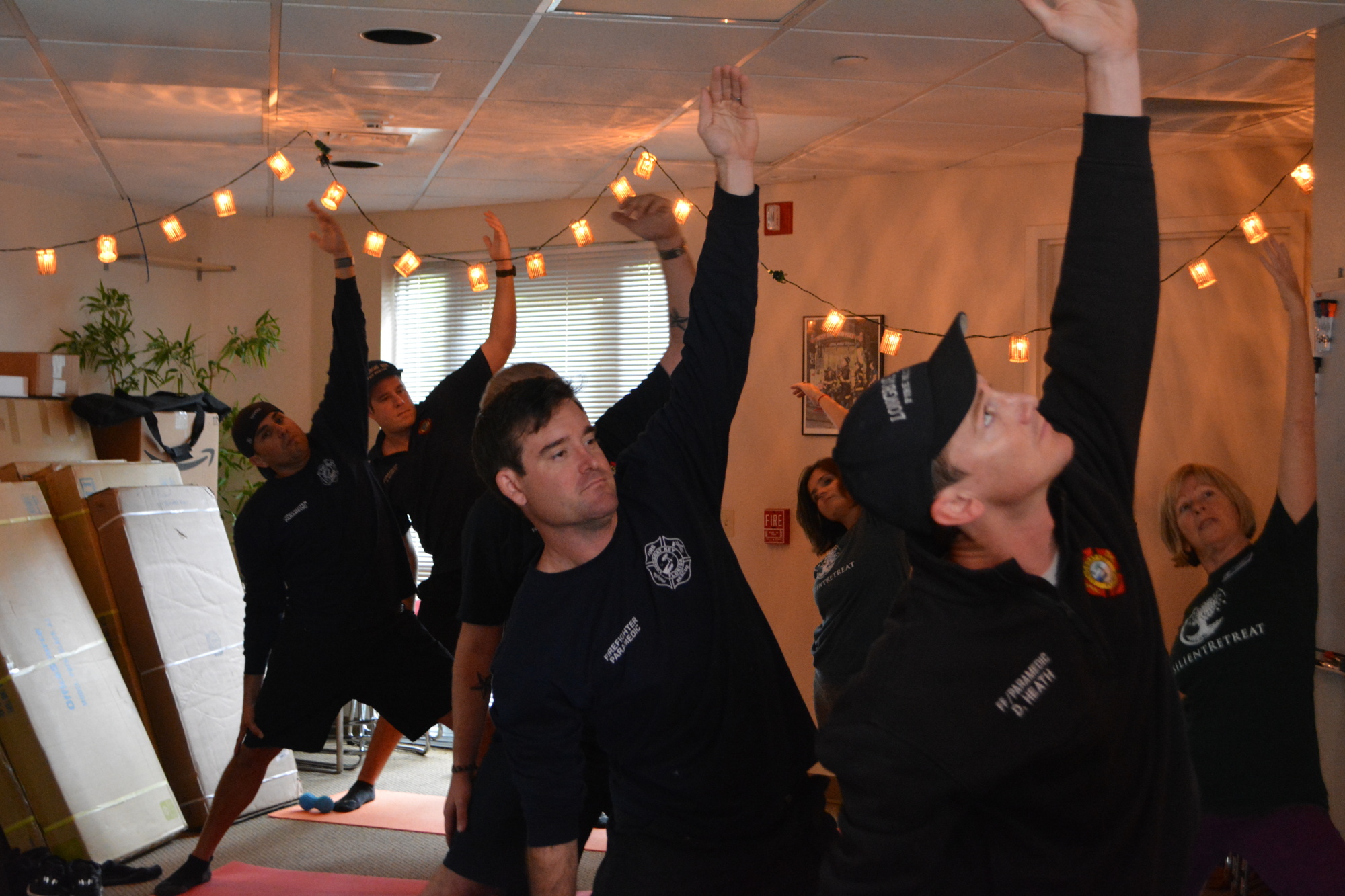 Longboat Key firefighters pose during a yoga session Jan. 30.