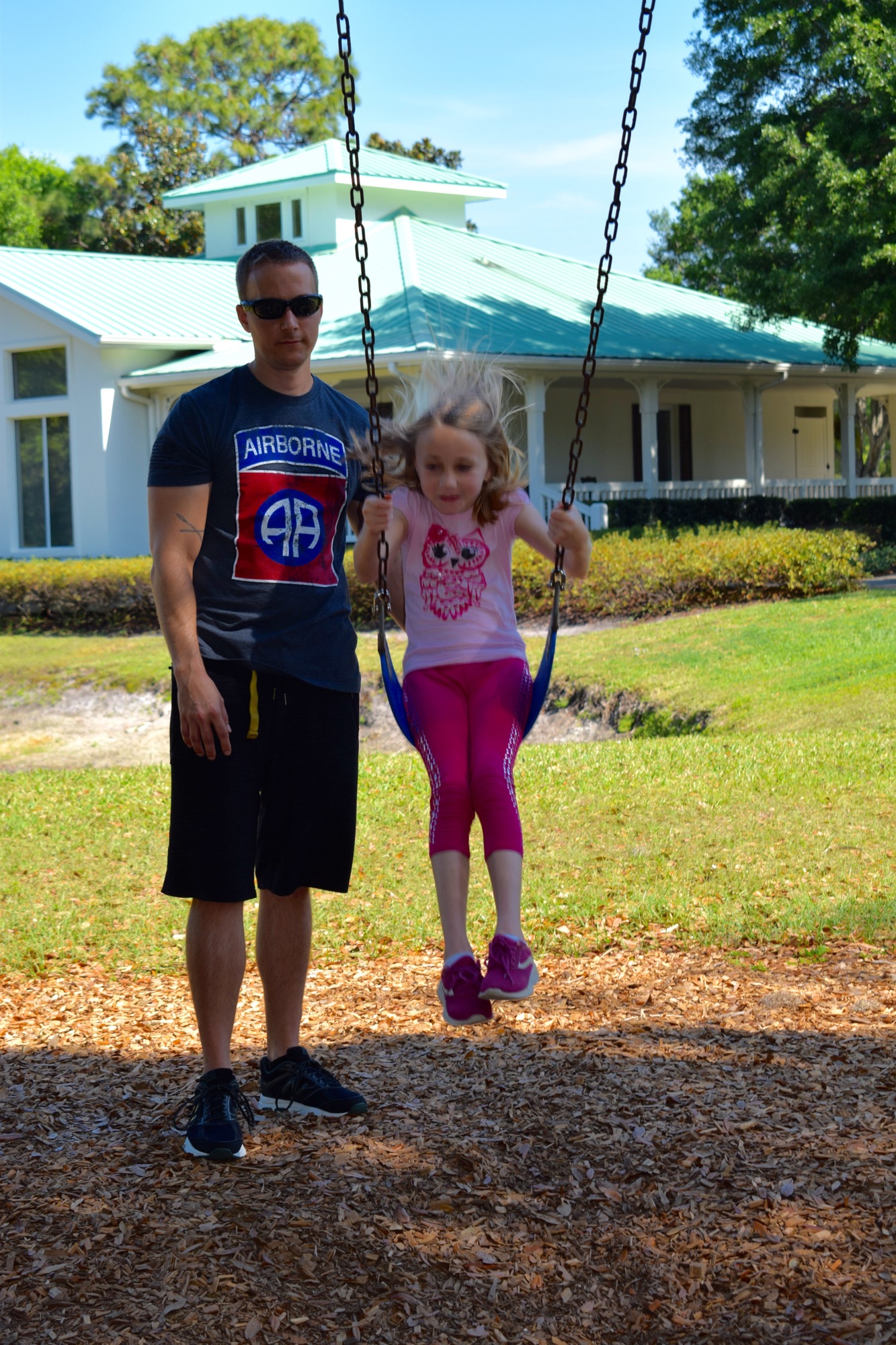 Sean Otter, a Lakewood Ranch resident, pushes his daughter Carina on a swing at Summerfield Community Park. Otter says finding daycare while schools are out an extended period of time can be hard.