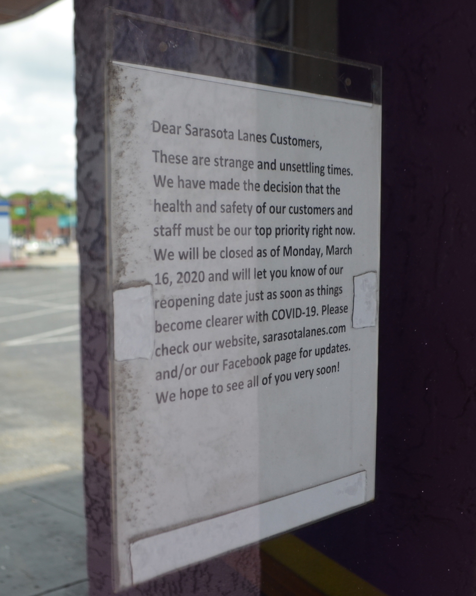 A sign in the window at Sarasota Lanes informs customers the business is closed indefinitely.