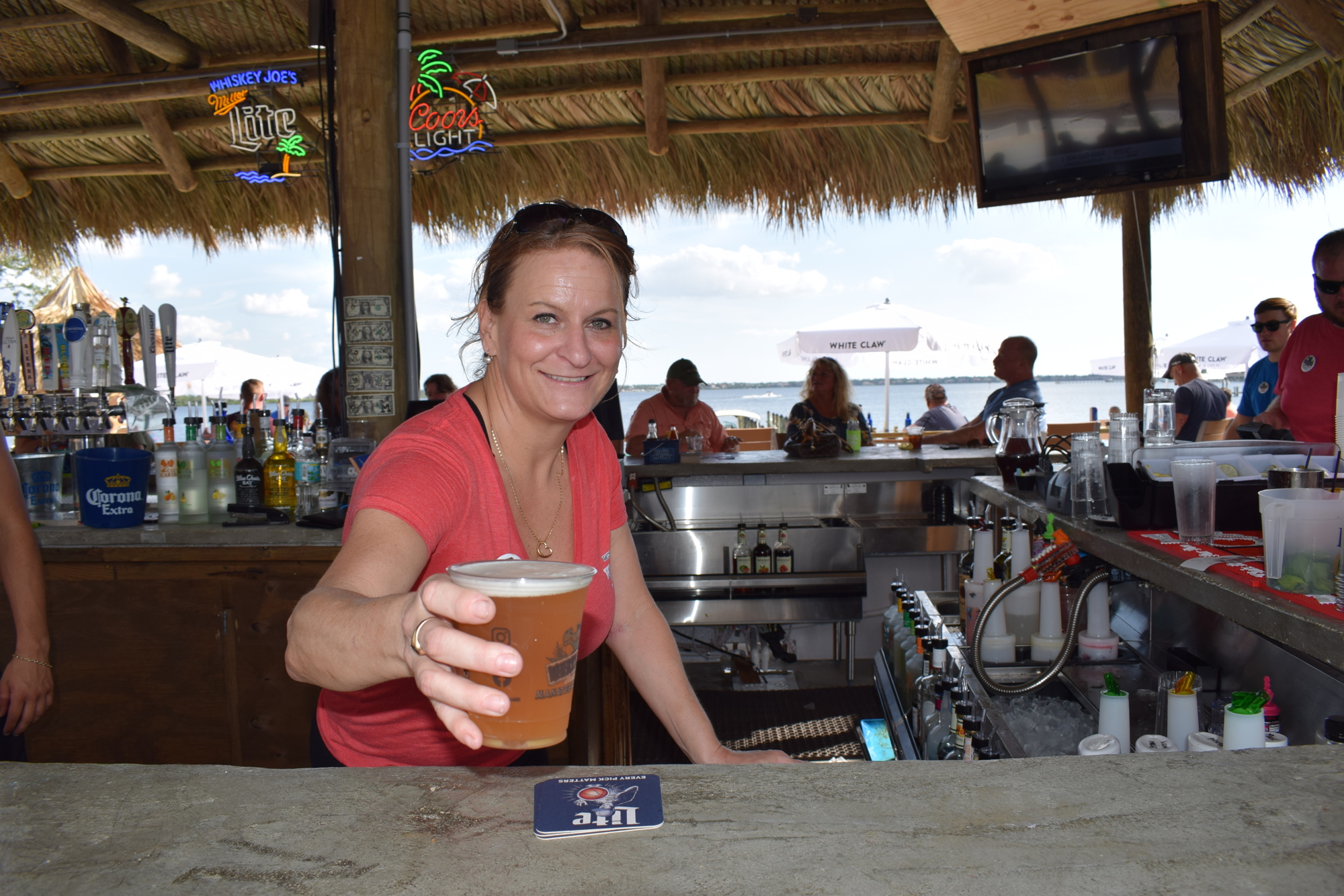 Bartender is Niki Simeone hands out an adult beverage at Whiskey Joe's on the Manatee River.