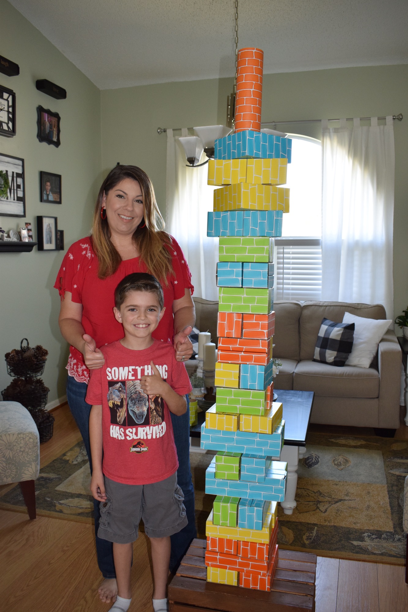 Sarah Colbath and her son Alex, who is a second grader, work together to build a tower, which is one of the activities for Tara Elementary's virtual spirit week.