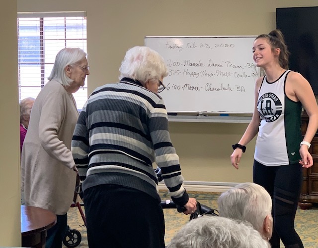Residents at Freedom Village of Bradenton dance along with Brooke Martin, a Girl Scout and senior at Lakewood Ranch High School. Courtesy photo.