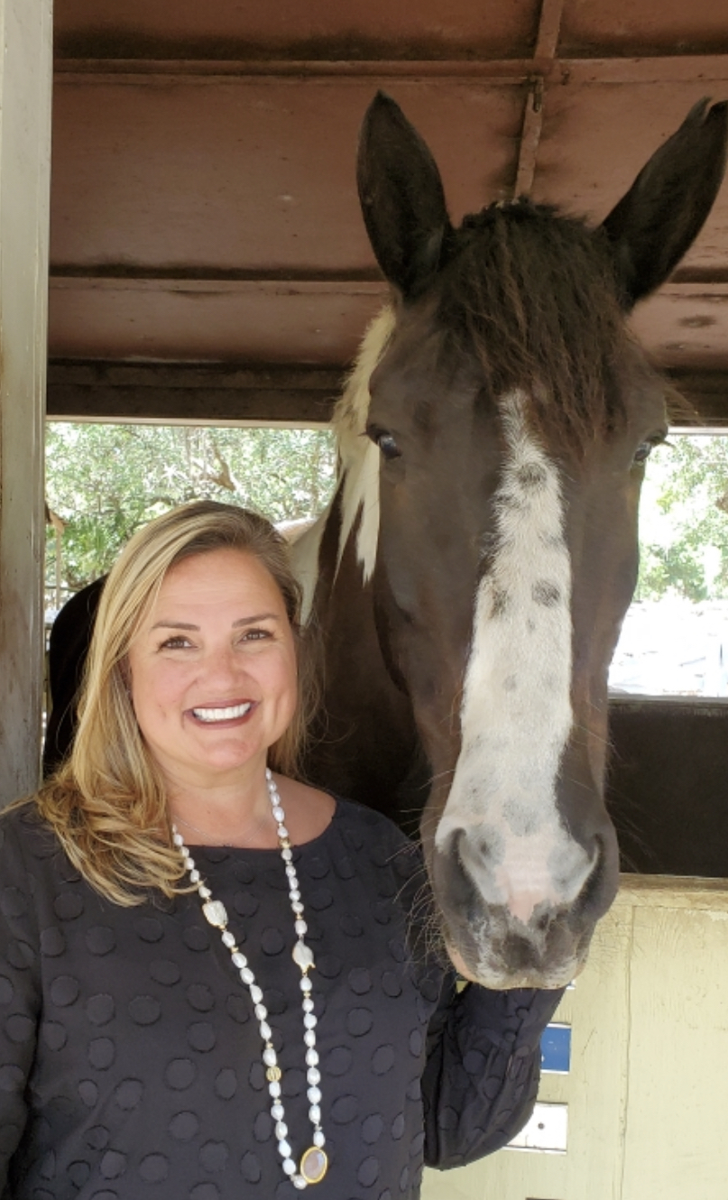 University Place's Rebecca Blitz, with Gallagher, grew up riding horses and has spent her career working with nonprofits. Courtesy photo.
