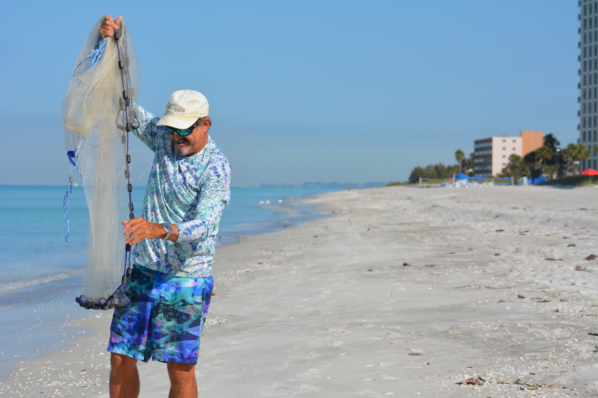 Beach Fishing Adventures proprietor Steven Herich prepares to cast a net in an attempt to catch bait Saturday on Longboat Key.
