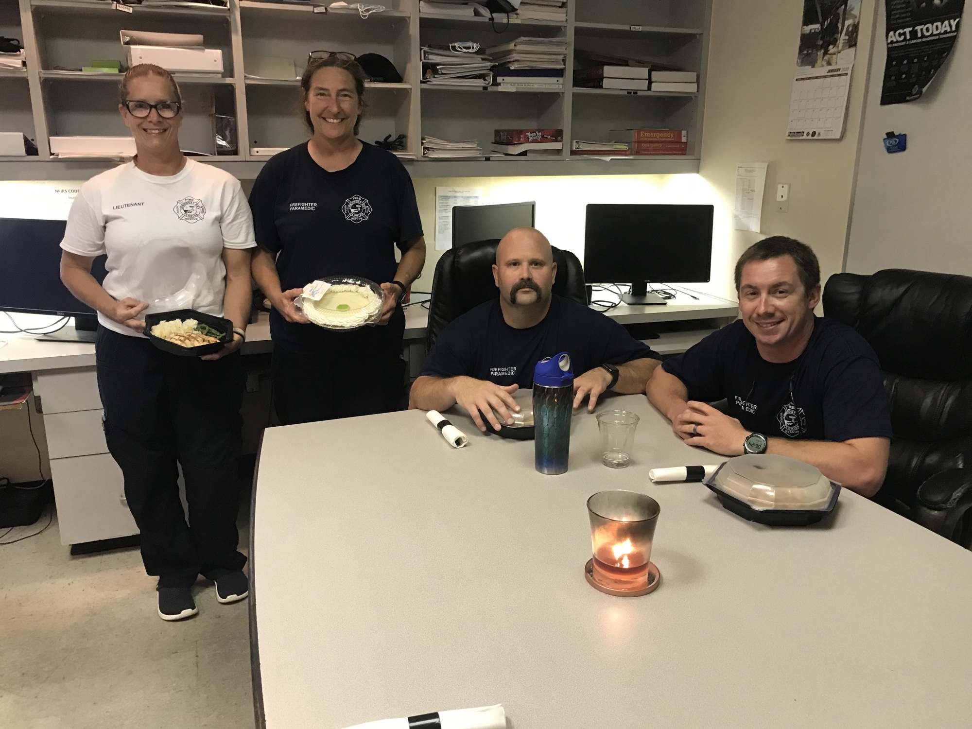 Lietenant Kerri Brooks, firefighter/paramedics Dawn Dunkum, Richard Roome and Chase Opela receive meals from Chart House. Photo courtesy of Tina Adams.