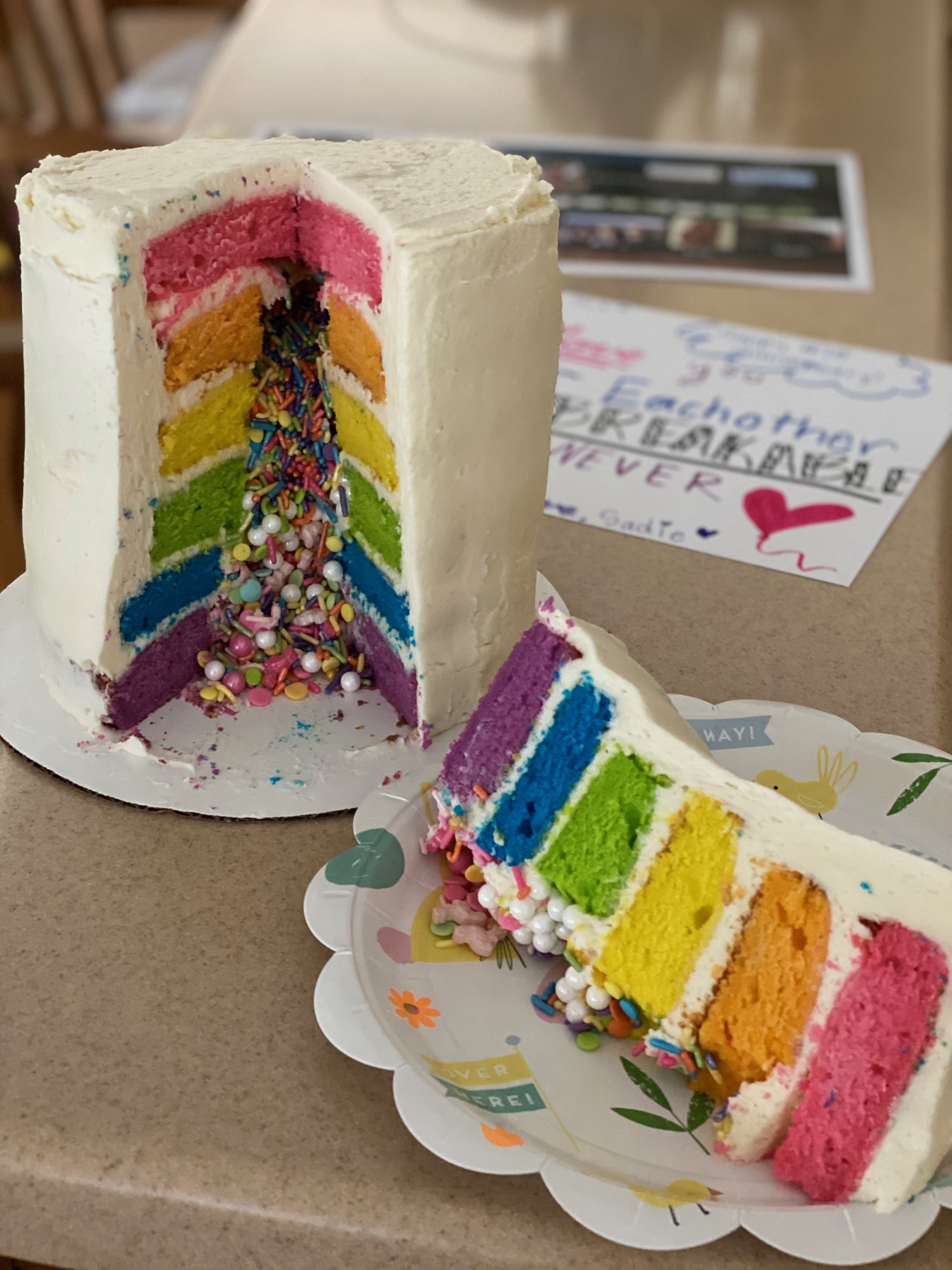 Valerie Demino delivers a rainbow cake she made from scratch. Courtesy photo.