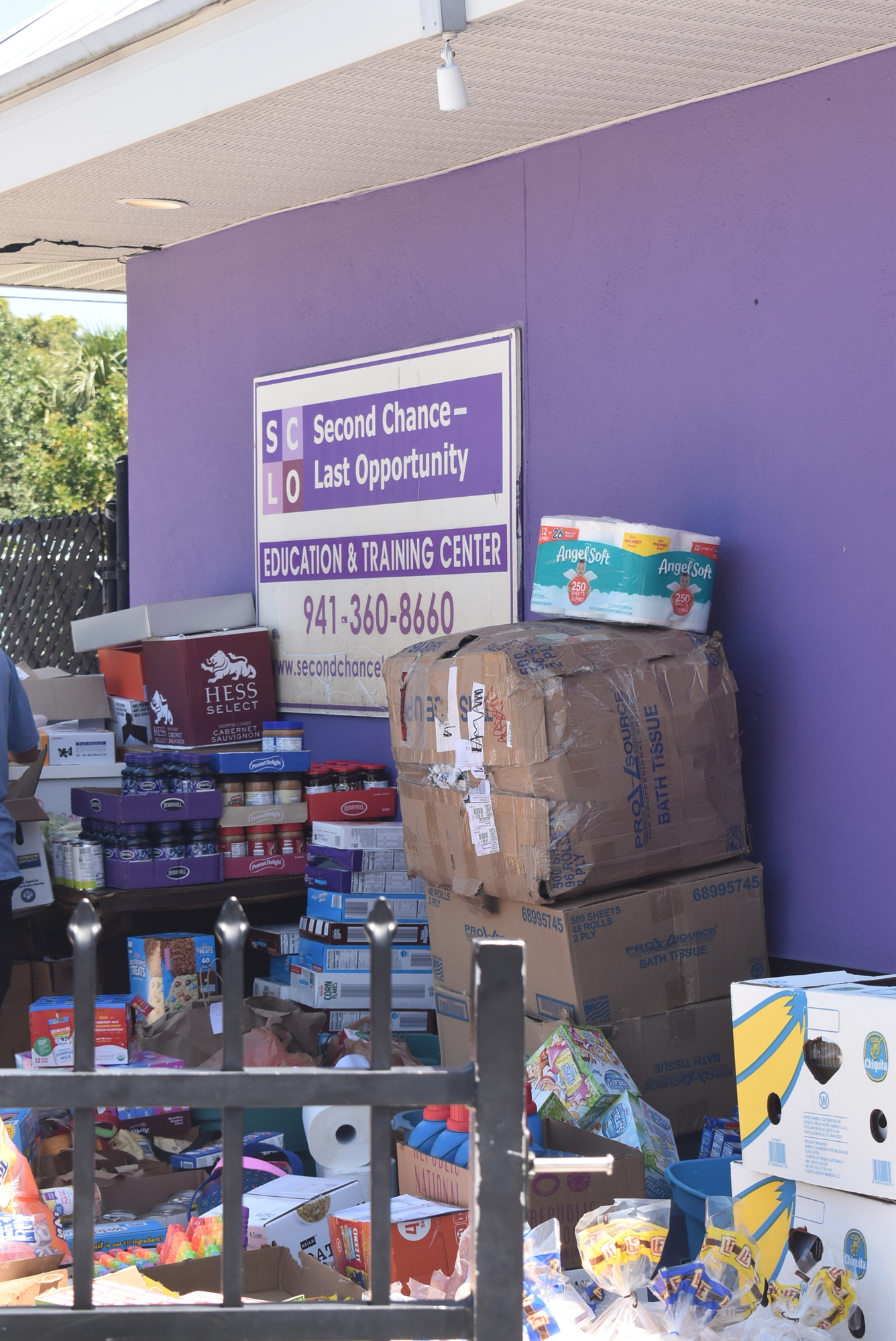 Piles of food and other home supplies go out to Second Chance Last Opportunity.
