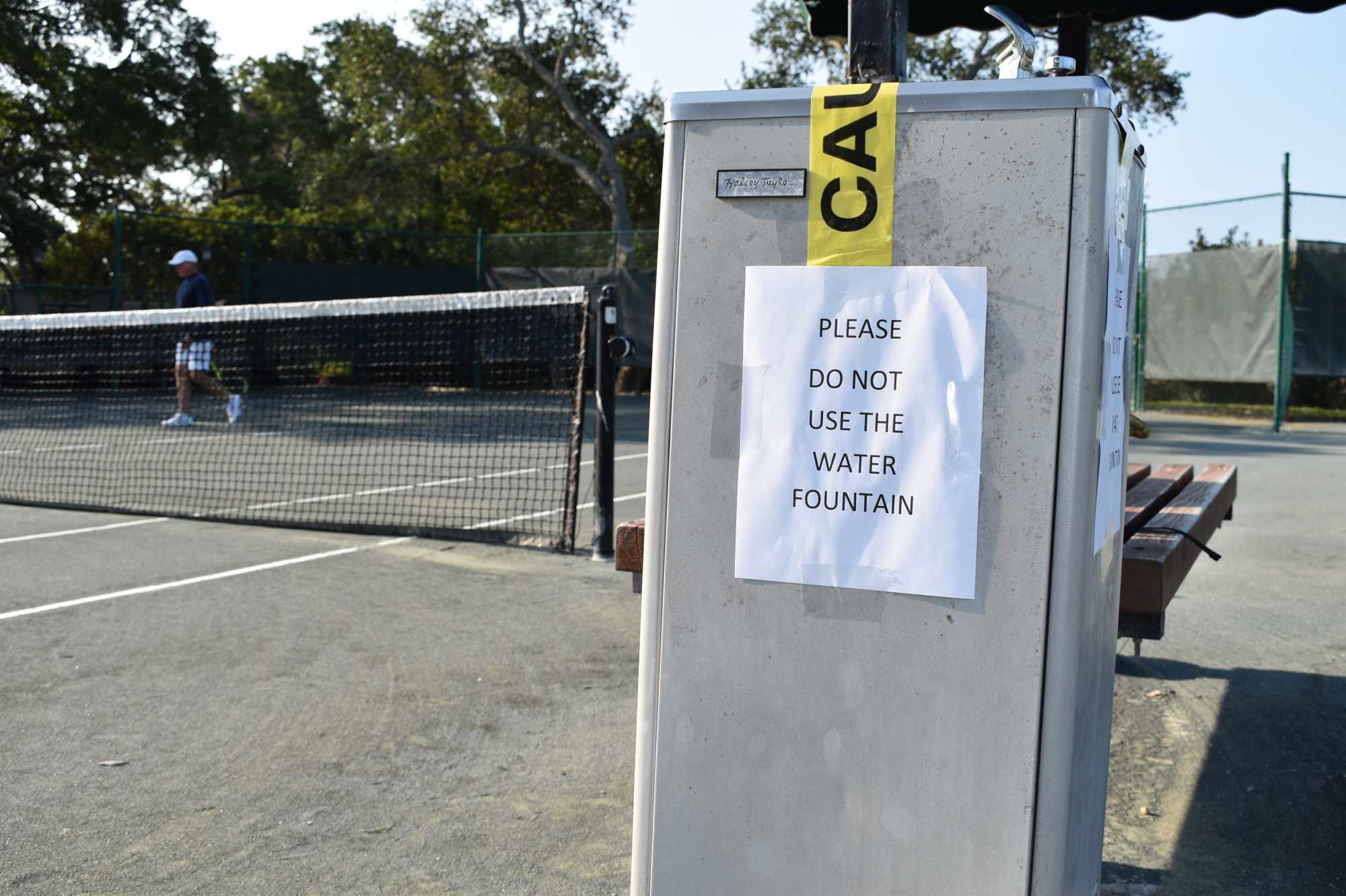 A sign warns members of the Longboat Key Tennis Center not to use the drinking fountains while restrictions are in place because of the COVID-19 pandemic.