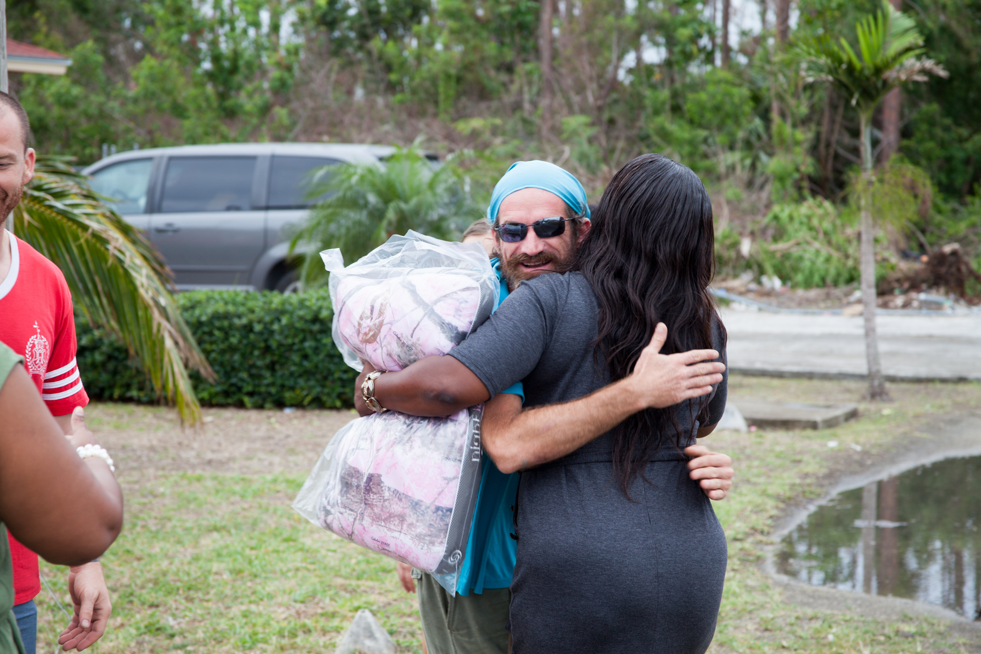 Bahamians and volunteers hug as Hope Fleet give out supplies. Photo courtesy