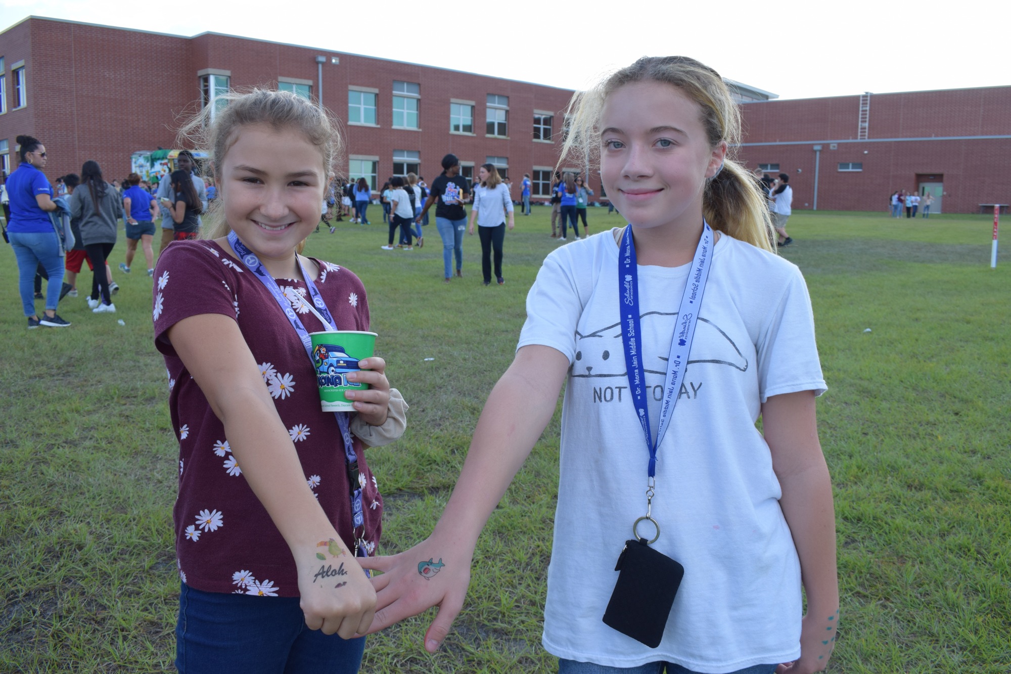 Olivia Autrey and Hana Pierce, sixth graders, show off their temporary tattoos during a field day that celebrated student success. Field days were some of the most memorable moments of the year for students. File photo.